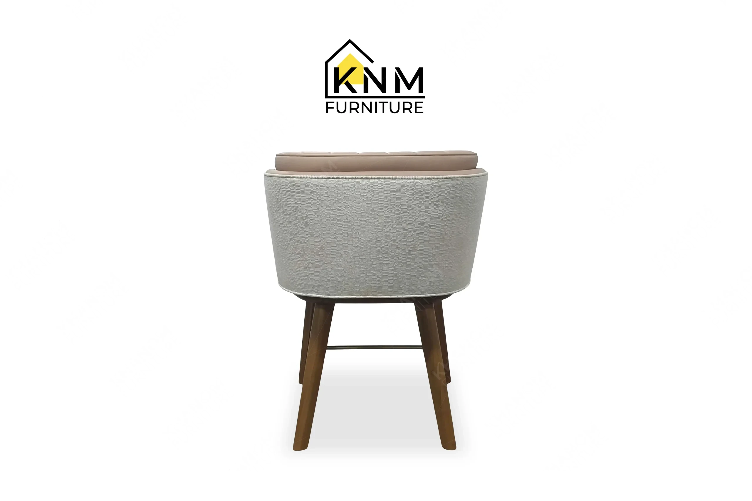 Rear perspective view emphasizing the flawless fabric tailoring on a custom upholstered dining chair built by Khanom Furniture (KNM Furniture), an expert Furniture factory Vietnam.