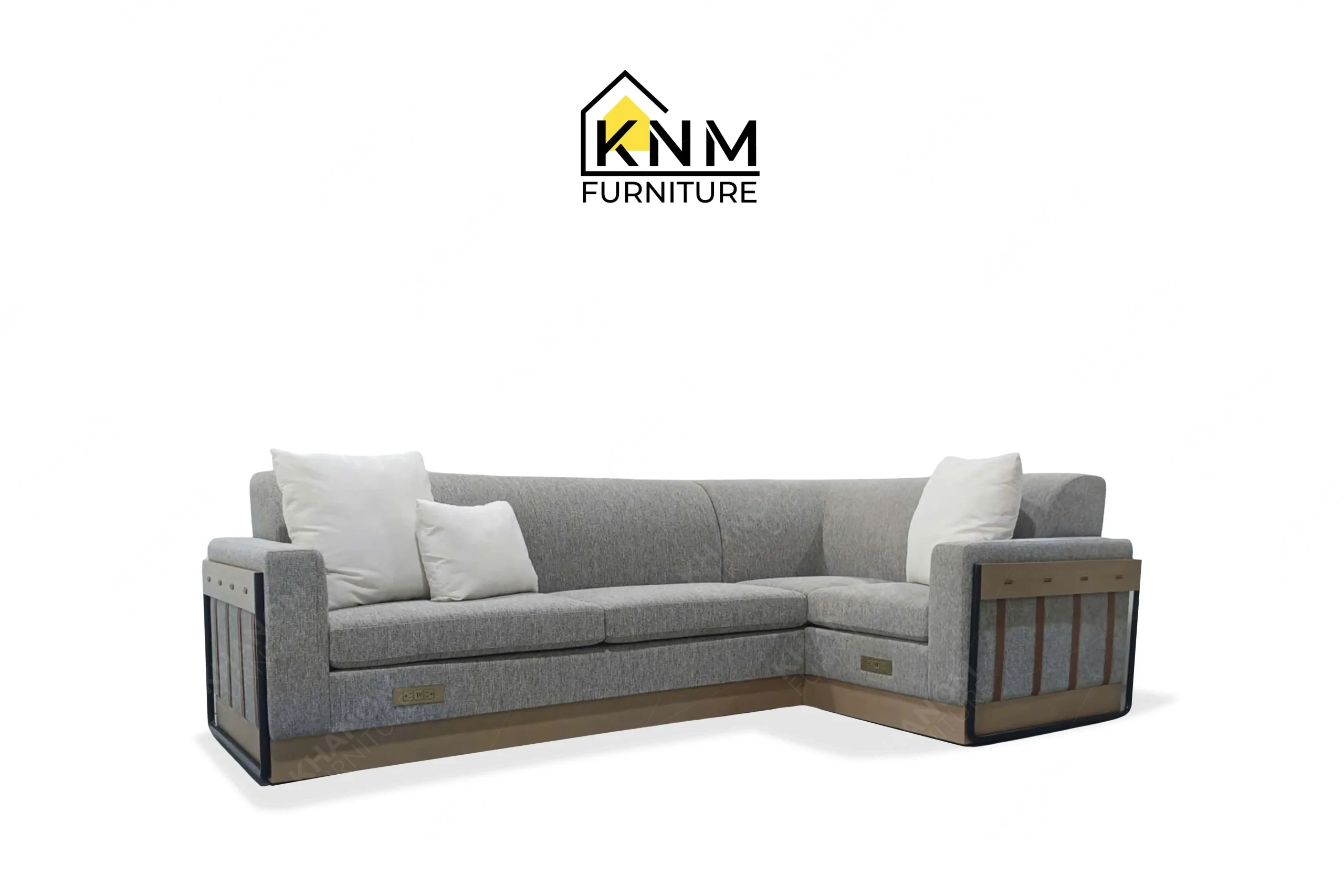 A 3/4 perspective view showing the graceful contemporary lines and premium grey upholstery of a bespoke hotel sectional sofa, masterfully crafted by Khanom Furniture (KNM Furniture), your trusted custom furniture factory Vietnam.