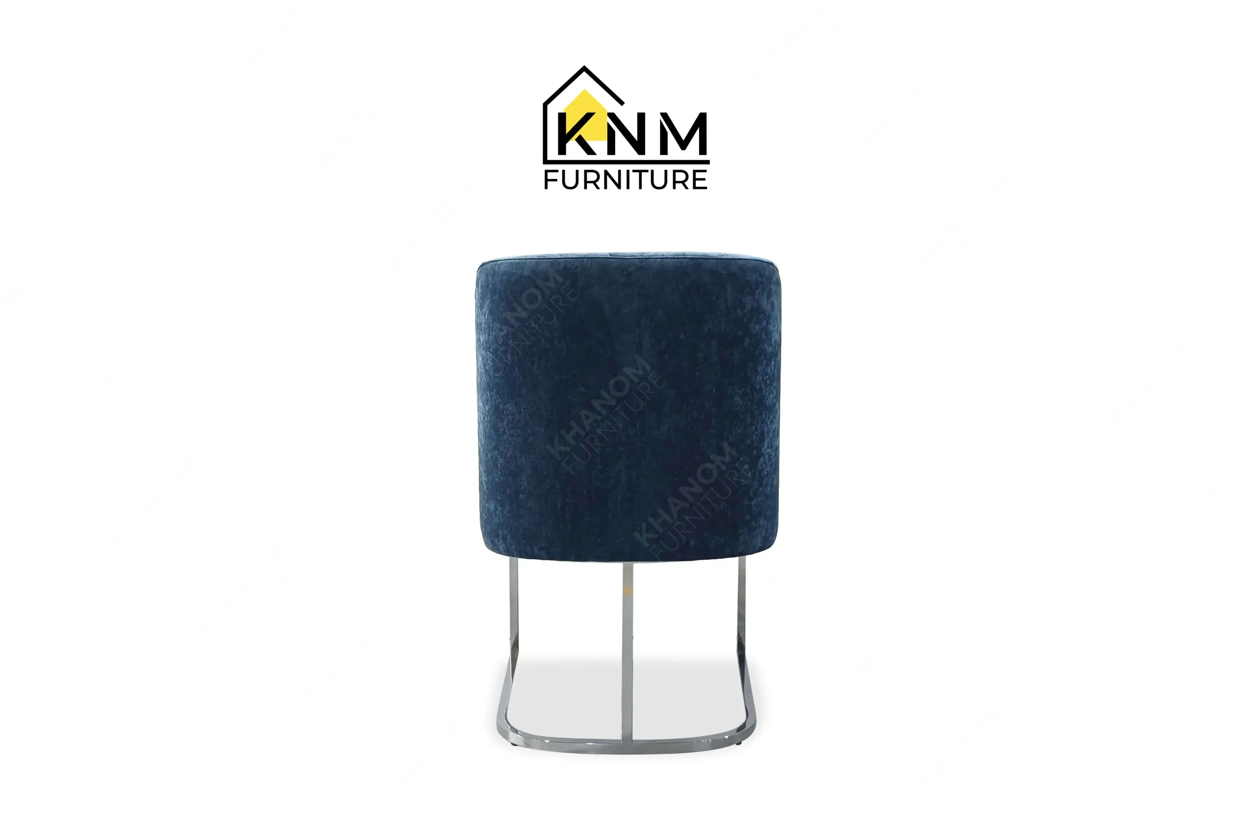 Side profile view of a sturdy contract-grade dining chair featuring indigo performance upholstery and a metal base, produced by Khanom Furniture (KNM Furniture), a dedicated bespoke furniture factory.