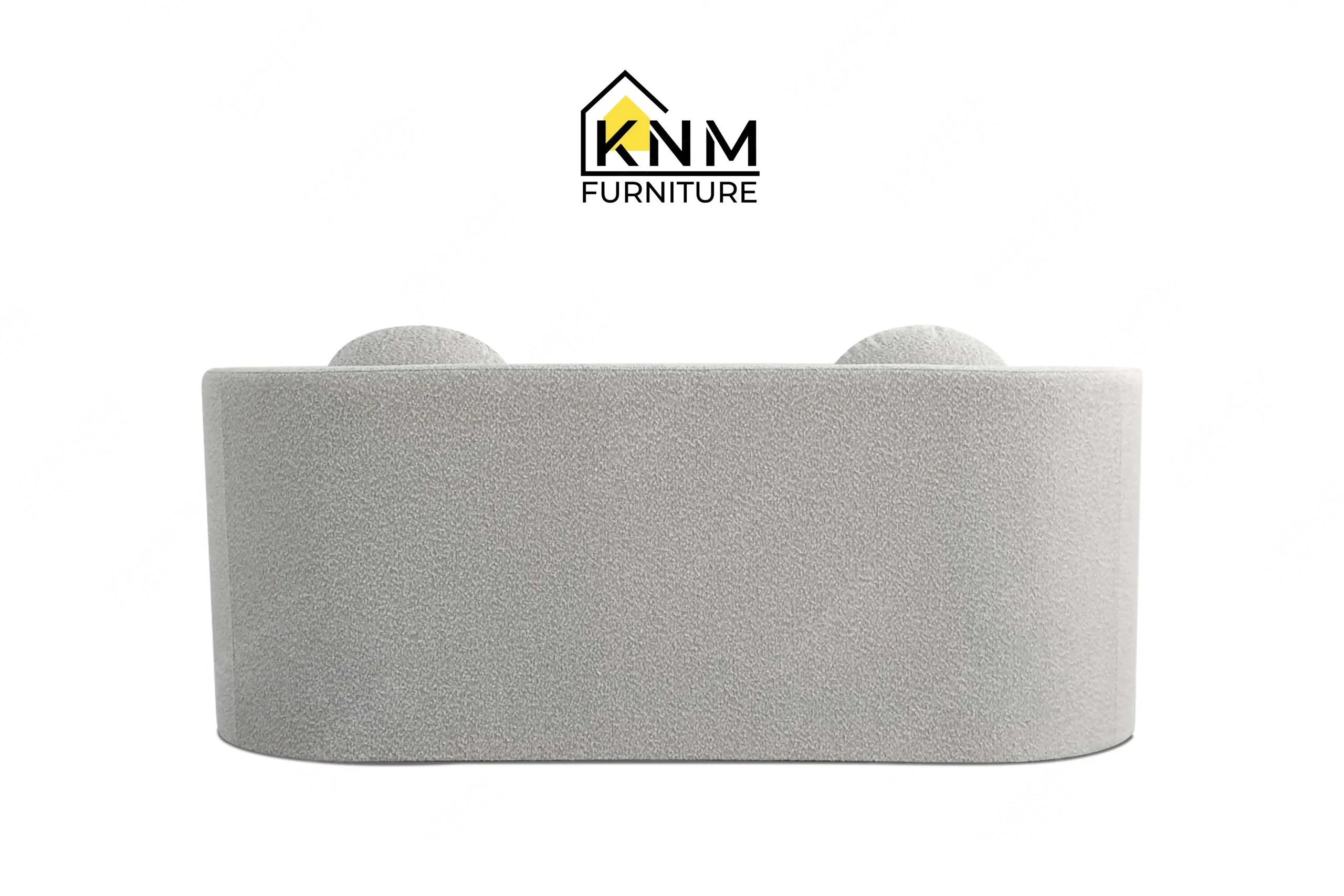 Direct back view of a premium bespoke daybed featuring smooth grey boucle upholstery, manufactured by Khanom Furniture (KNM Furniture), a dedicated contract furniture manufacturer.