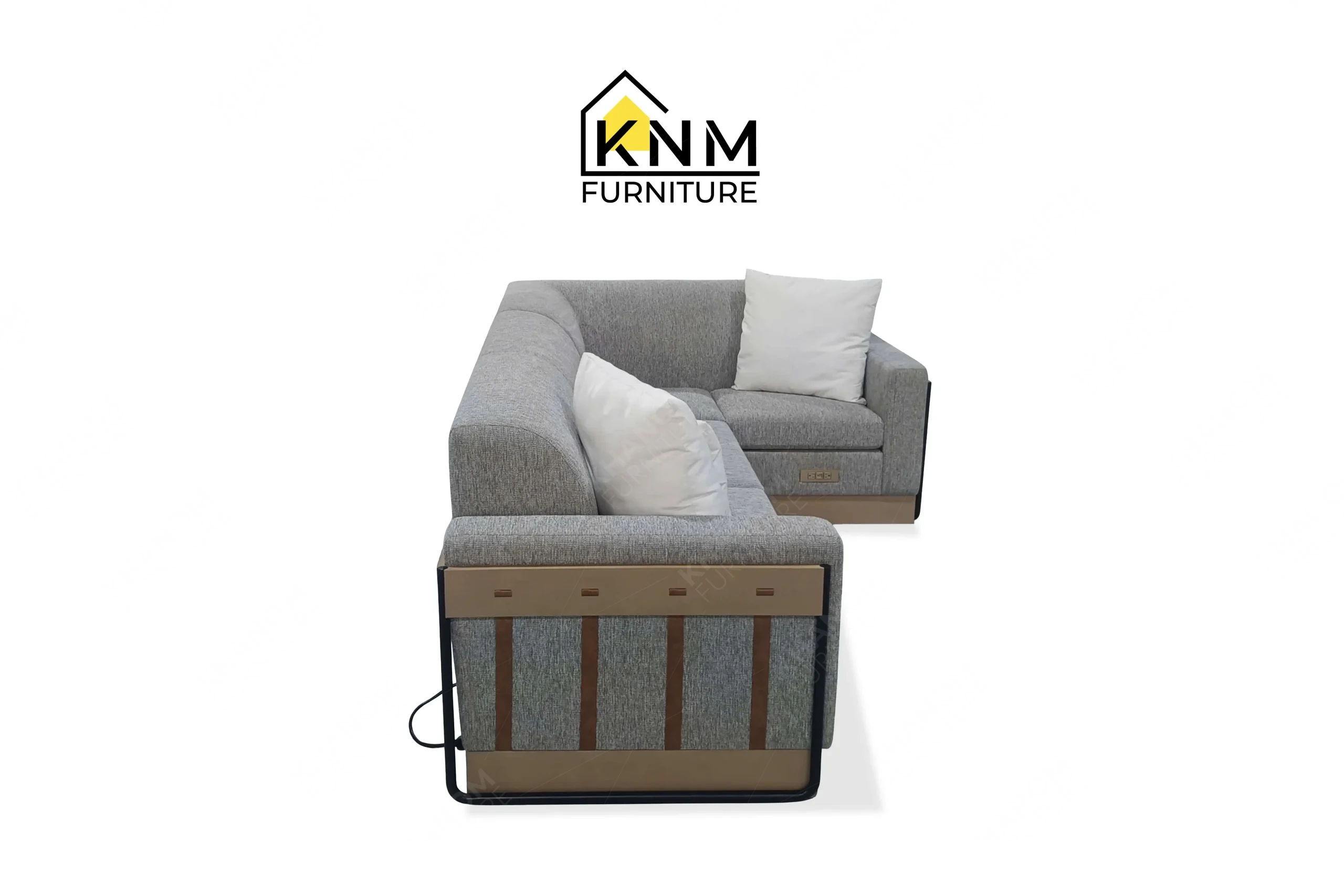 Side profile view of a sturdy contract-grade sleeper sectional featuring leather strap details on a metal frame, produced by Khanom Furniture (KNM Furniture), a dedicated bespoke furniture factory.