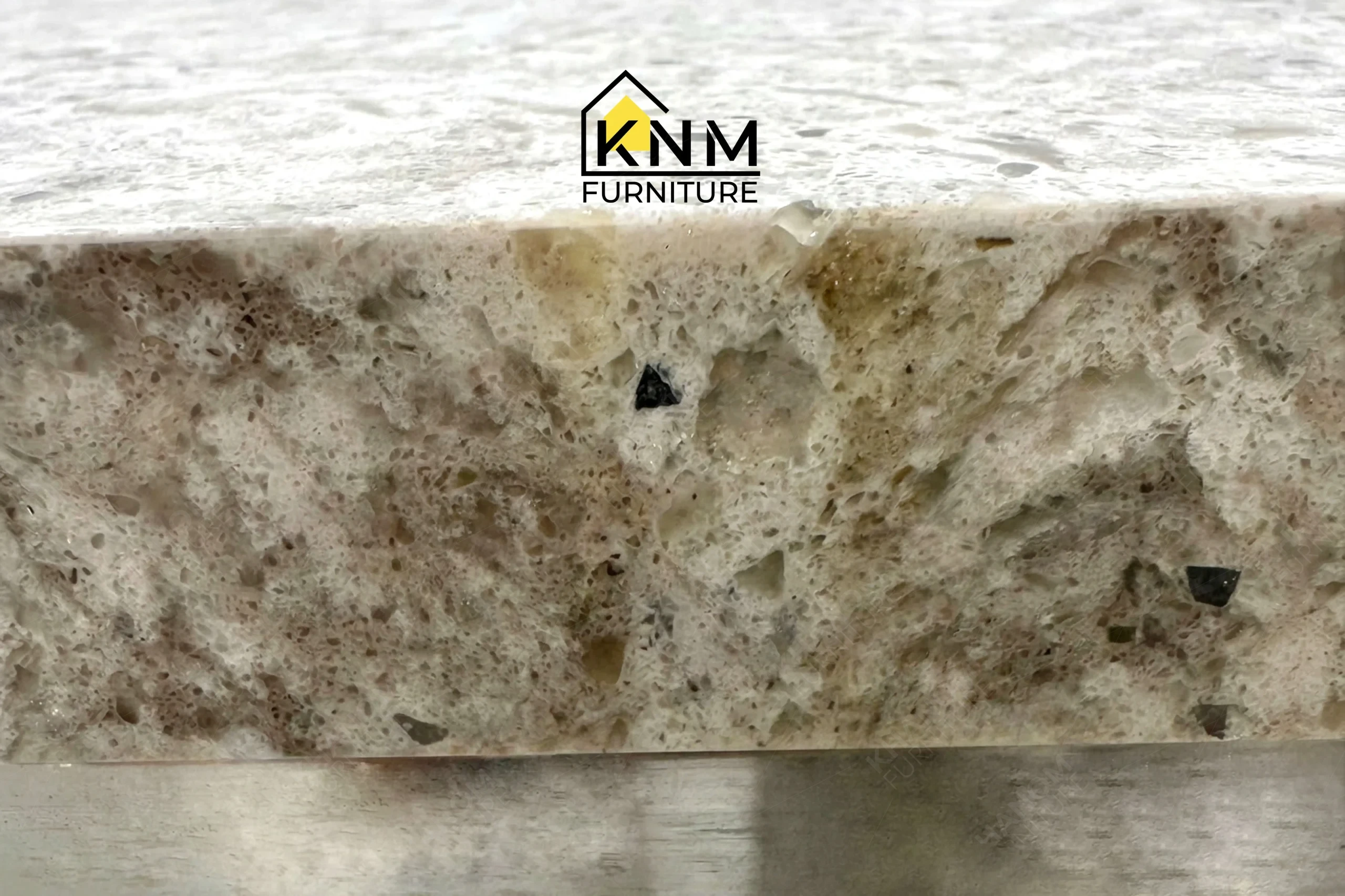 Zoom detail showcasing the premium material integration of a bespoke quartz and chrome martini table, meticulously manufactured by Khanom Furniture (KNM Furniture), your reliable custom furniture manufacturer Vietnam.