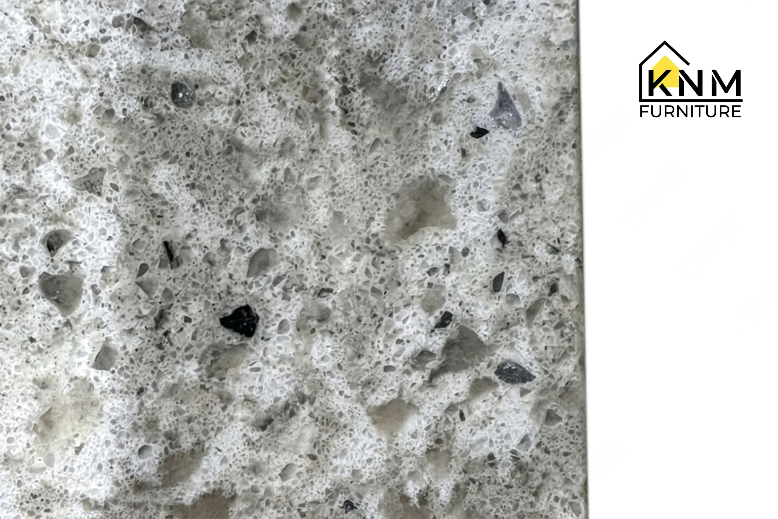 Detailed view of the polished quartz surface texture on a premium hospitality side table, crafted by Khanom Furniture (KNM Furniture), a premier hospitality furniture manufacturer.