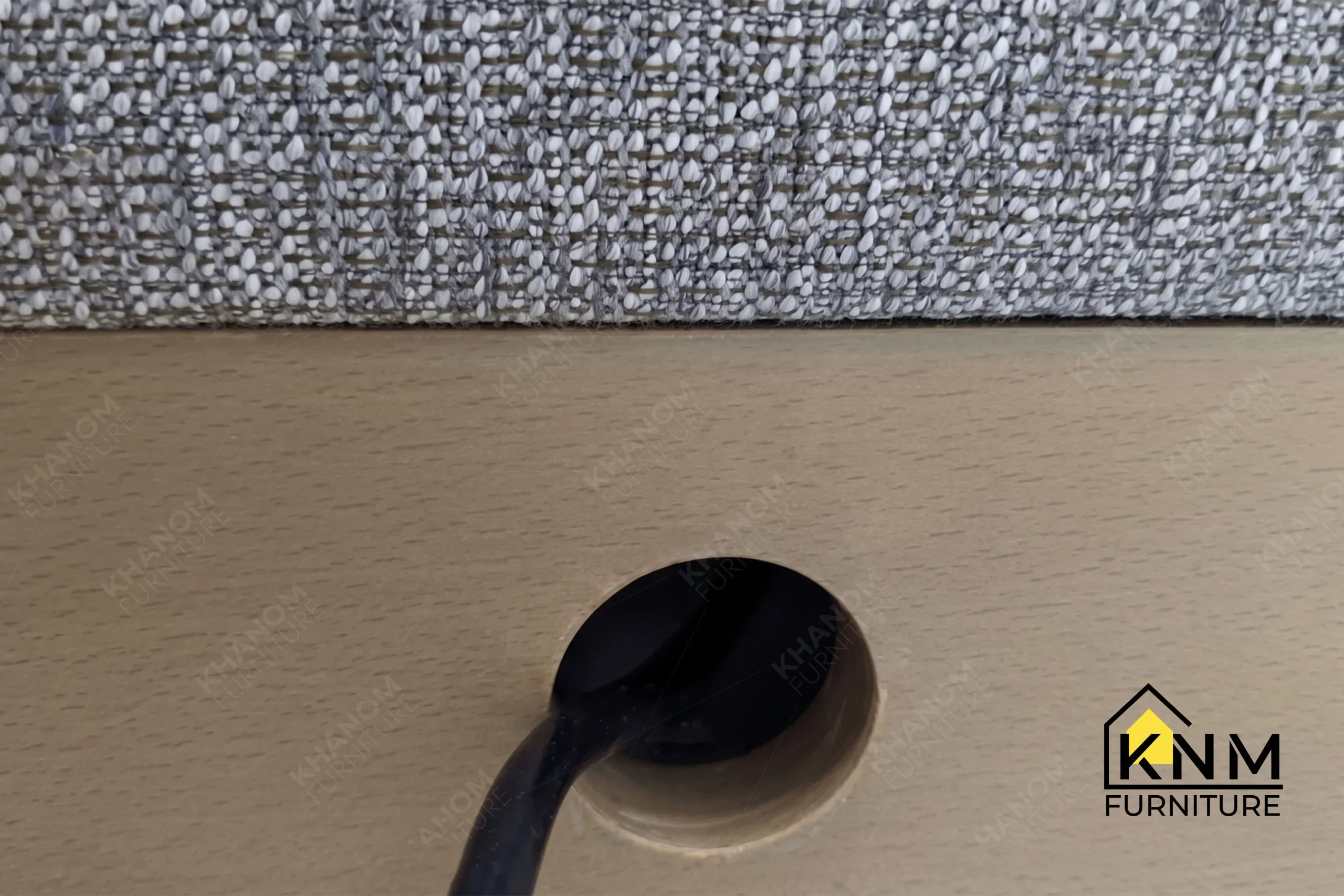 Close-up detail highlighting the refined internal craftsmanship and robust hardware integration of a custom sleeper sofa manufactured by Khanom Furniture (KNM Furniture), an established contract furniture factory Vietnam.