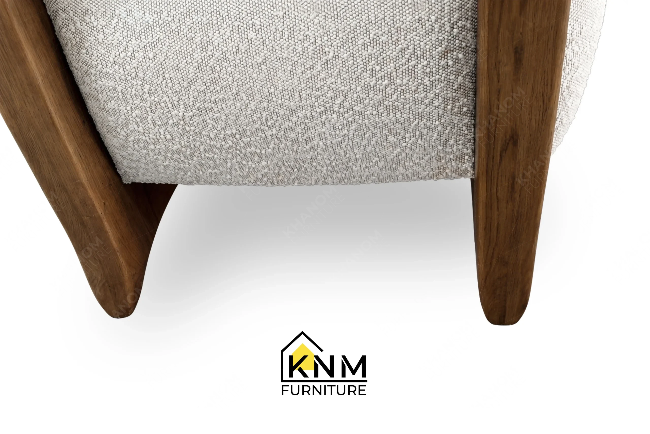 Zoom detail showcasing the premium materials and flawless finishing of a bespoke oak lounge chair, meticulously manufactured by Khanom Furniture (KNM Furniture), your reliable upholstery factory Vietnam.