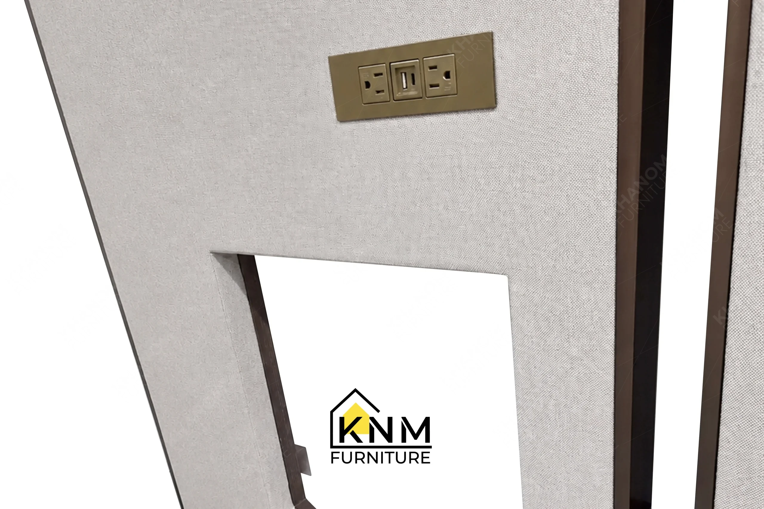 A detailed material zoom of the bronze Granex upholstered bed system by Khanom Furniture, showing the fabric texture adjacent to the plated metal.