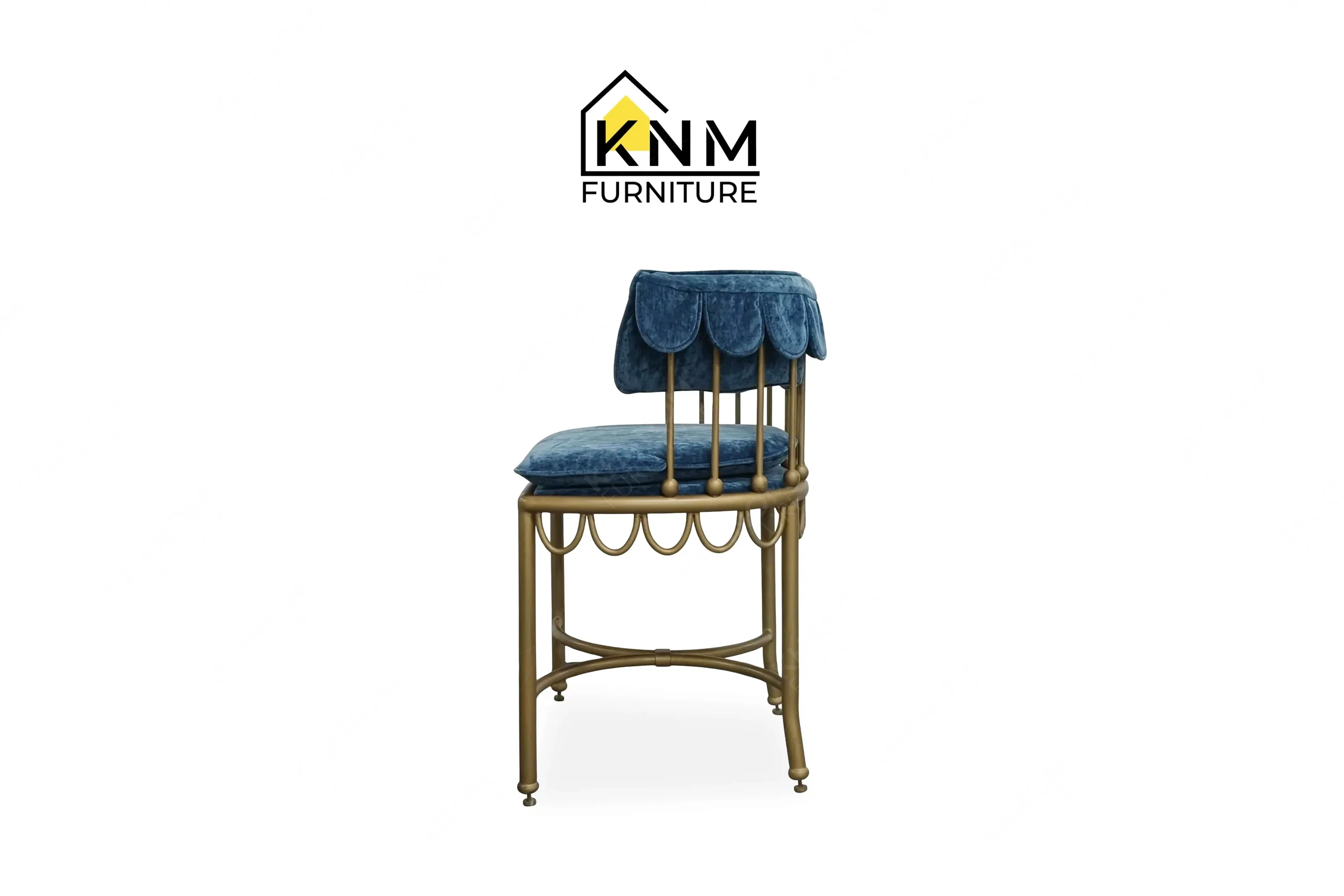 The side profile of the scalloped brass outdoor dining chair highlights the structural cast iron framing and anti-rust foot glides specified by Khanom Furniture.