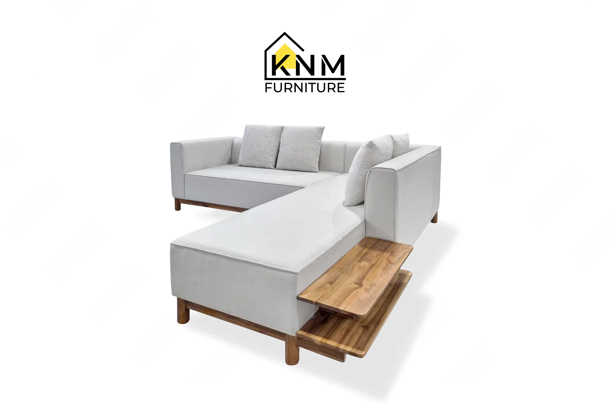 The side profile of the solid teak outdoor sectional sofa highlights the integrated teak side table specified by Khanom Furniture.