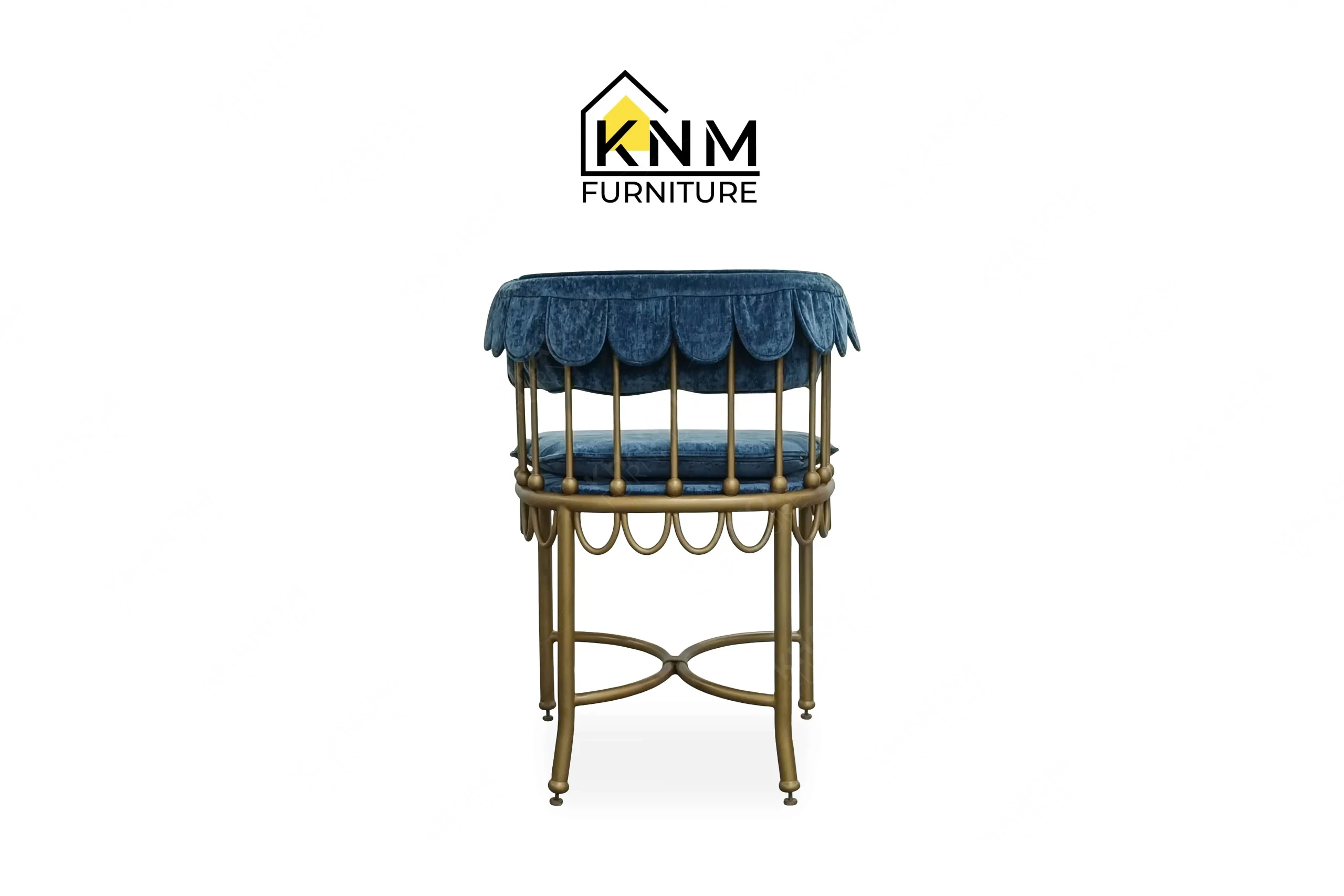 This direct back view captures the intricate scalloped metal detailing on the scalloped brass outdoor dining chair engineered by Khanom Furniture.