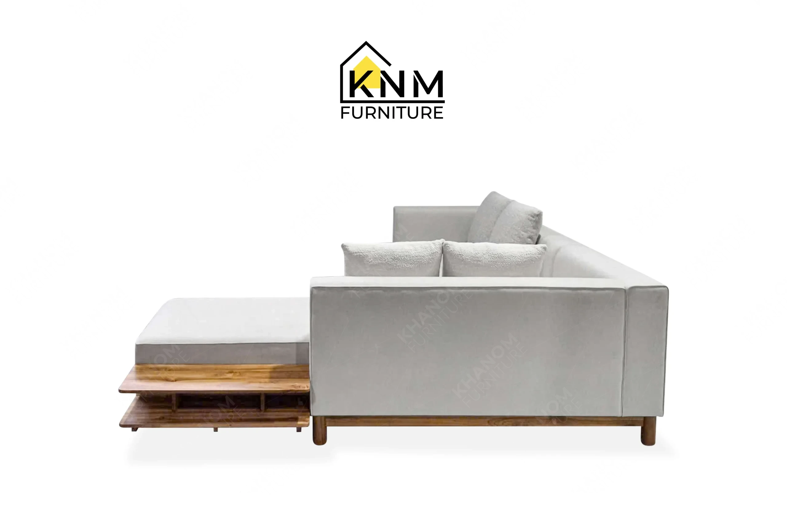 This rear view captures the continuous backrest upholstery and solid teak base of the outdoor sectional sofa engineered by Khanom Furniture.