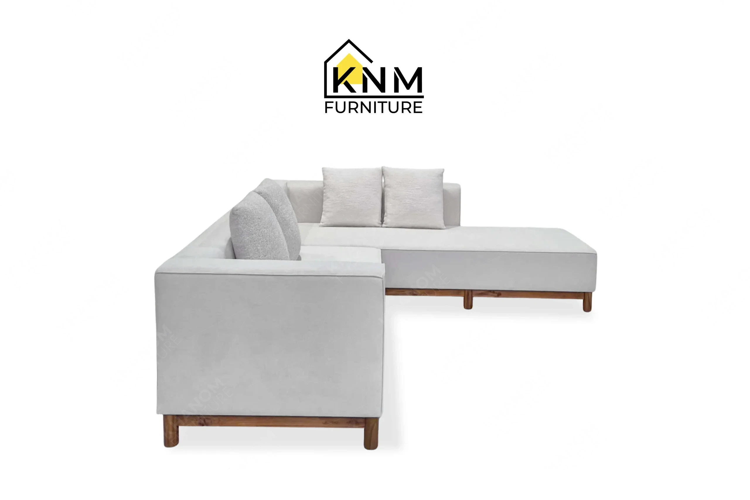 The right side profile of the solid teak outdoor sectional sofa highlights the integrated teak side table specified by Khanom Furniture.