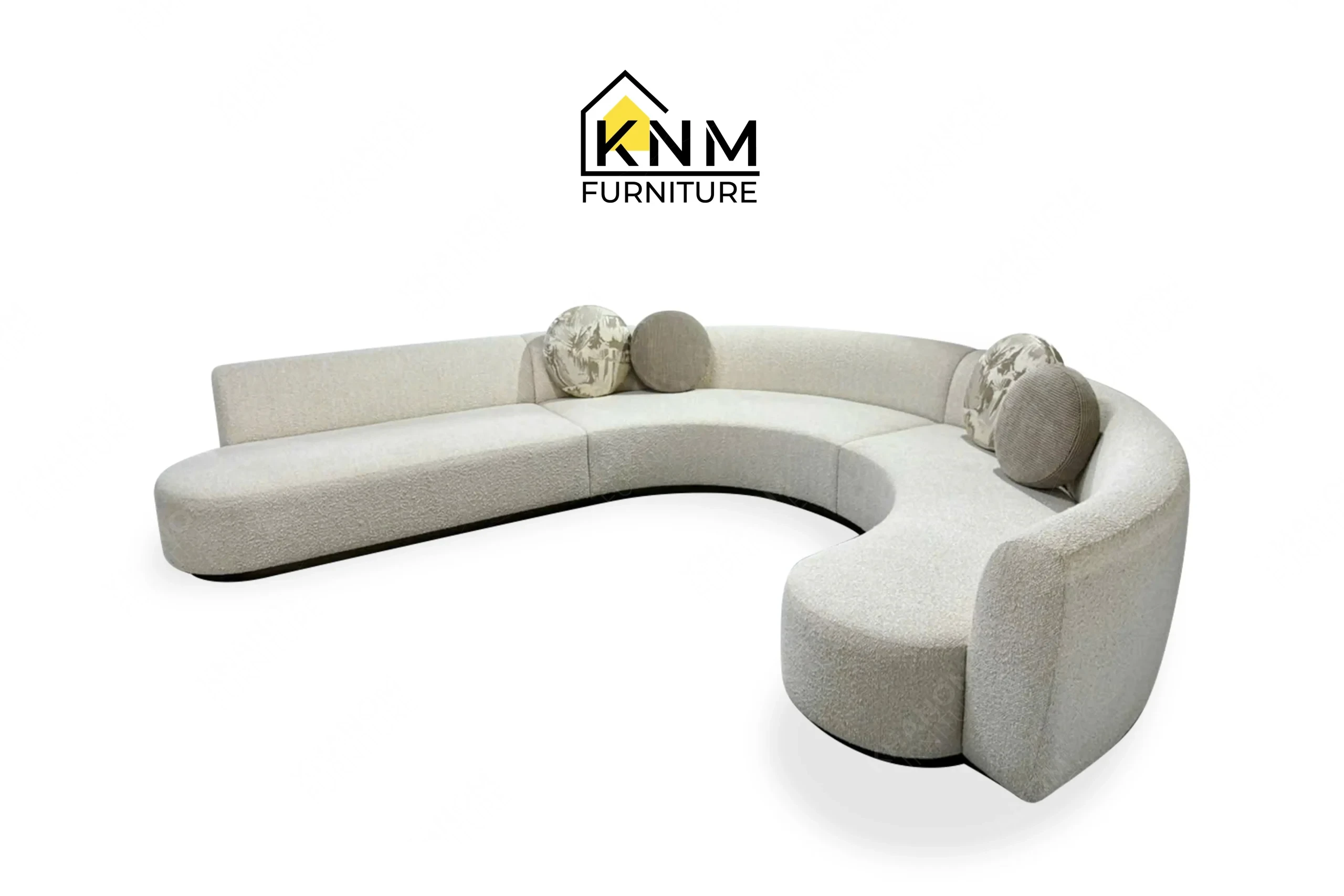 This front view displays the curved Opuzen fabric sectional sofa manufactured by Khanom Furniture, highlighting the sweeping radiuses and tight upholstery.