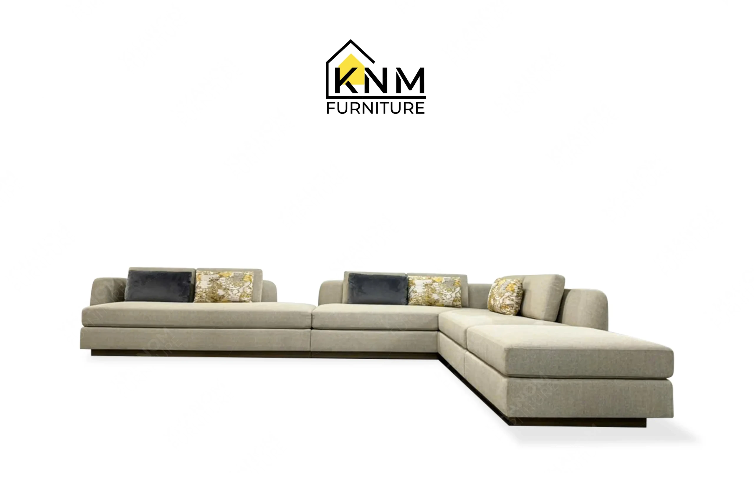 This front view displays the modular Erica Shamrock sectional sofa manufactured by Khanom Furniture, highlighting the expansive seating span and fabric application.