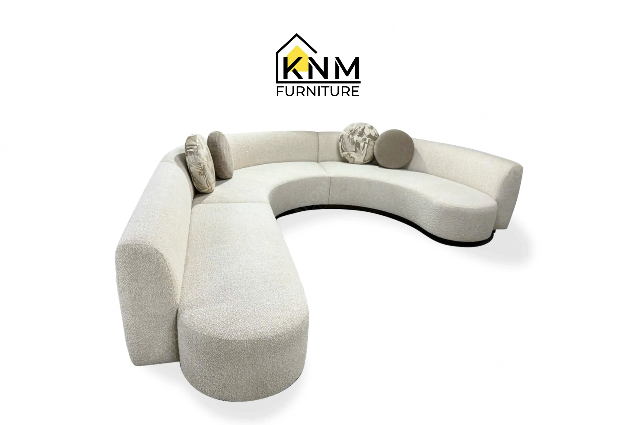 A perspective view illustrating the modular integration and sweeping lines of the curved Opuzen fabric sectional sofa produced by Khanom Furniture.