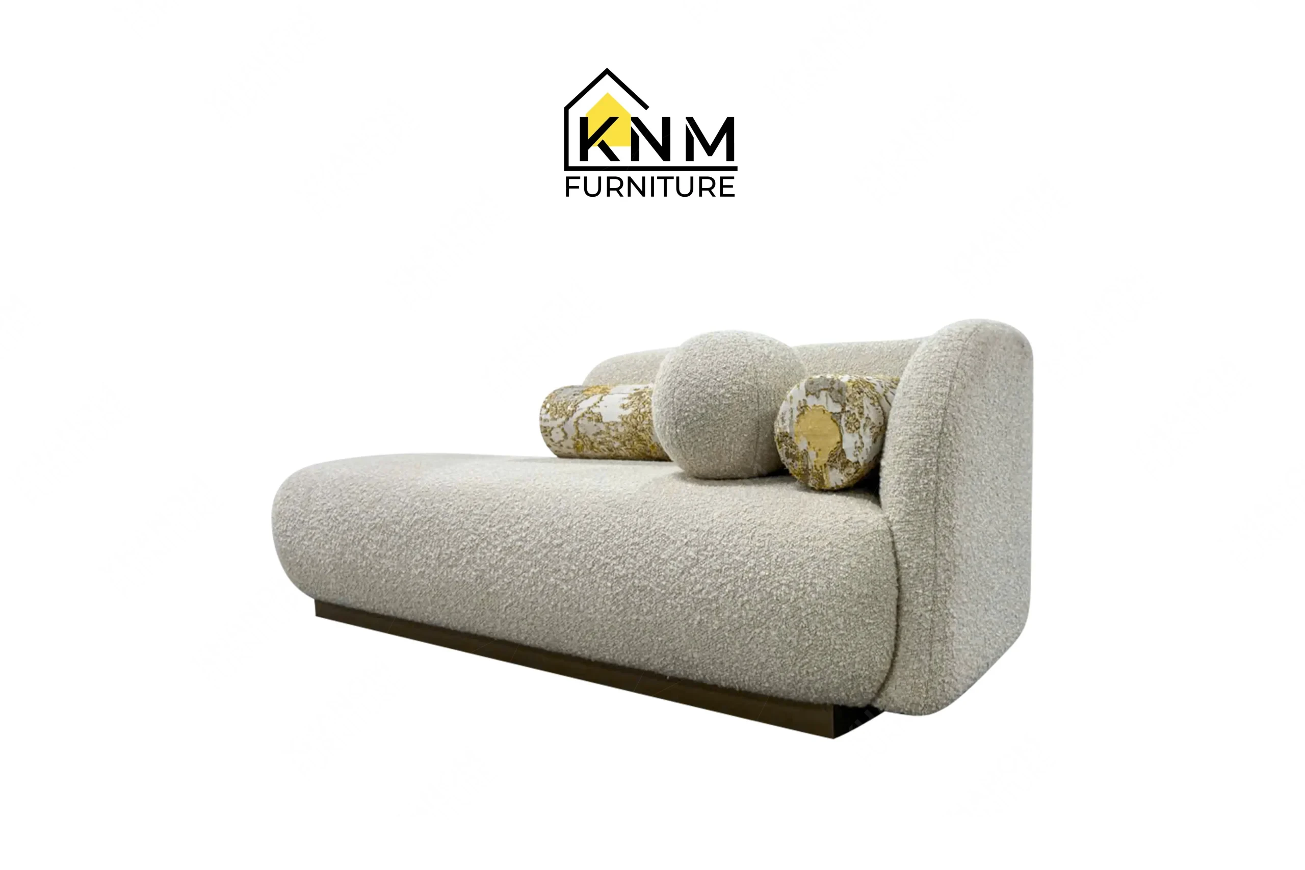 A perspective view illustrating the curved backrest and deep seating of the Opuzen fabric asymmetrical bedroom sofa produced by Khanom Furniture.