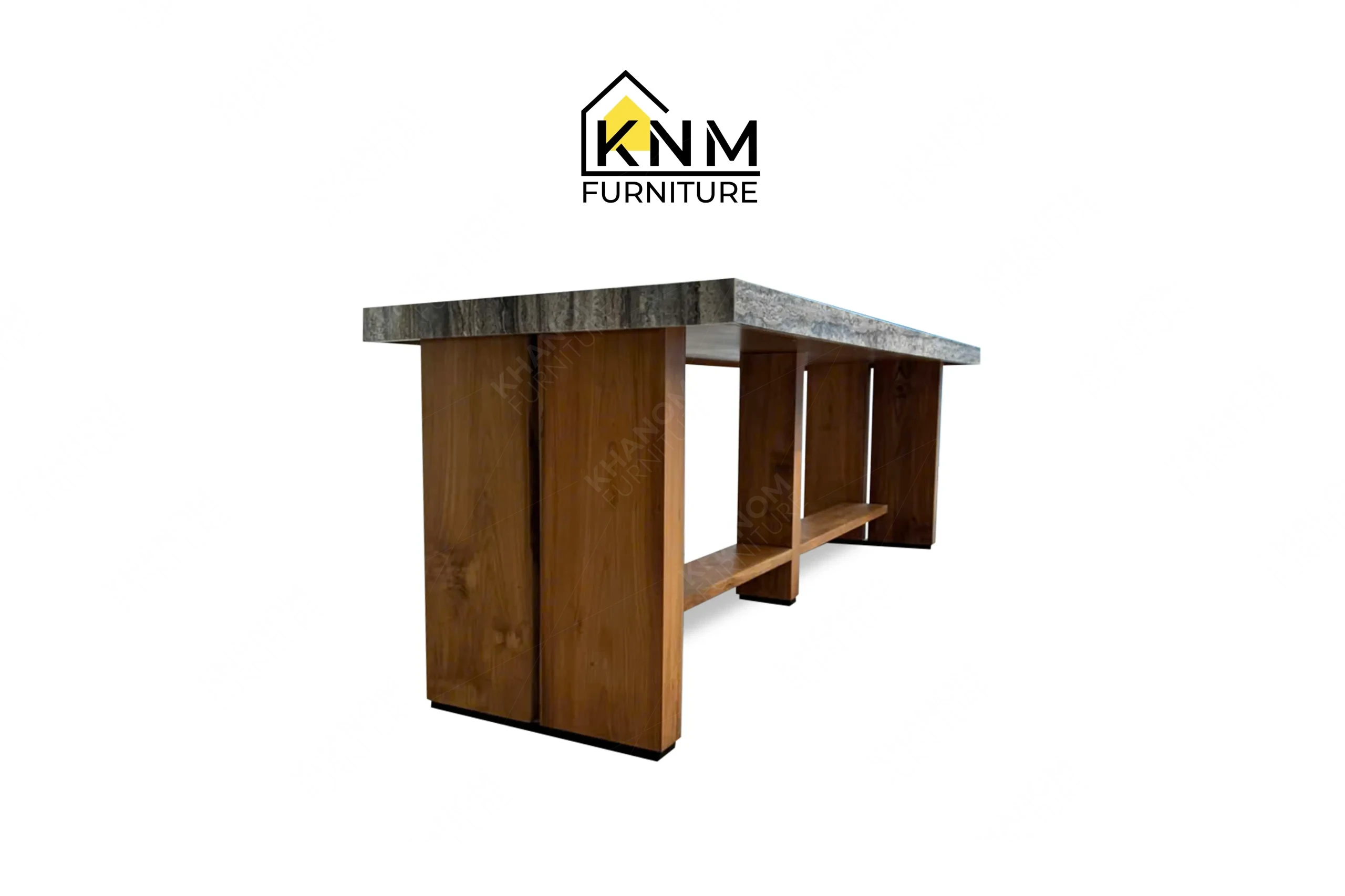 A perspective view illustrating the heavy stone top and solid wood pillar base of the communal table produced by Khanom Furniture.