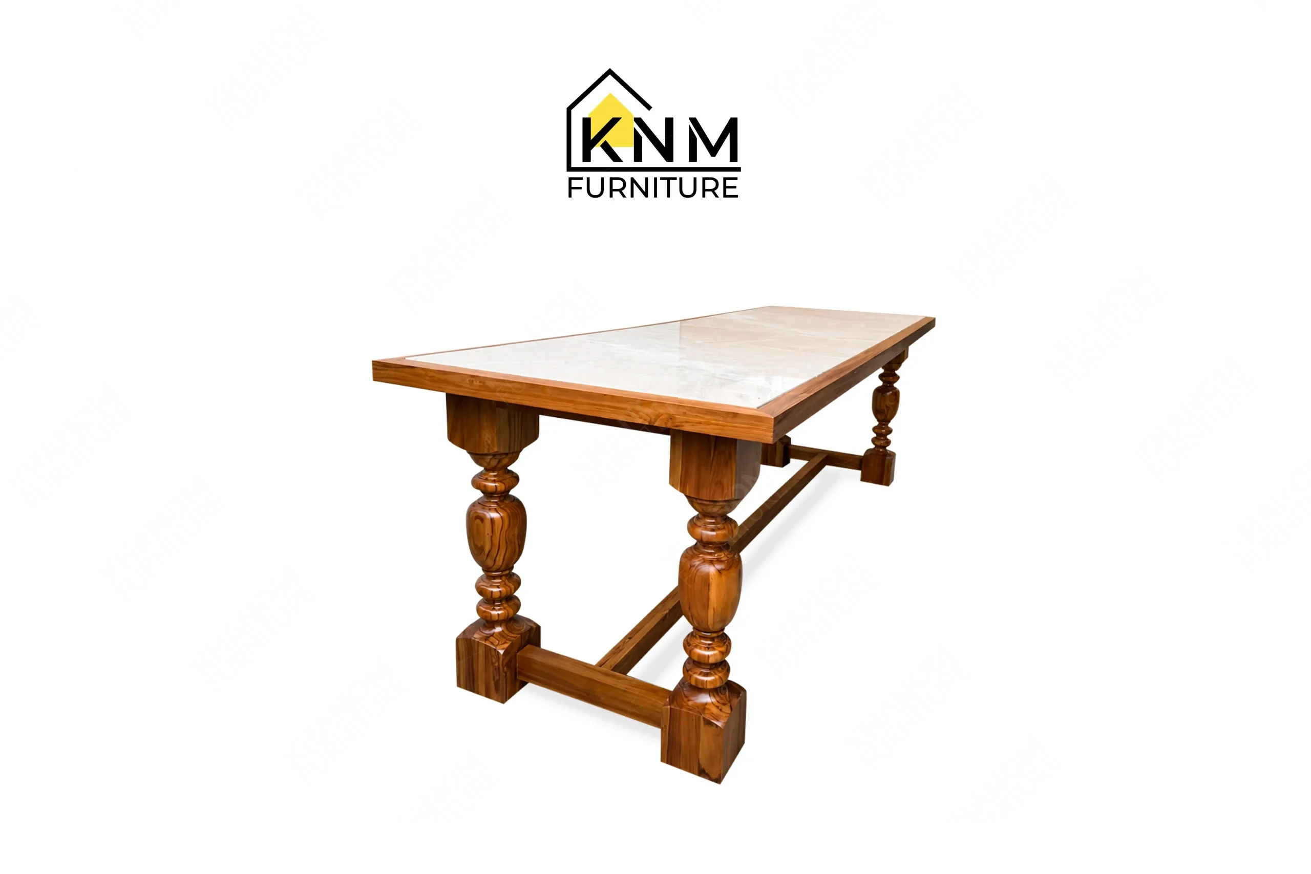 A perspective view illustrating the heavy turned base and inset stone of the stone top teak communal table produced by Khanom Furniture.