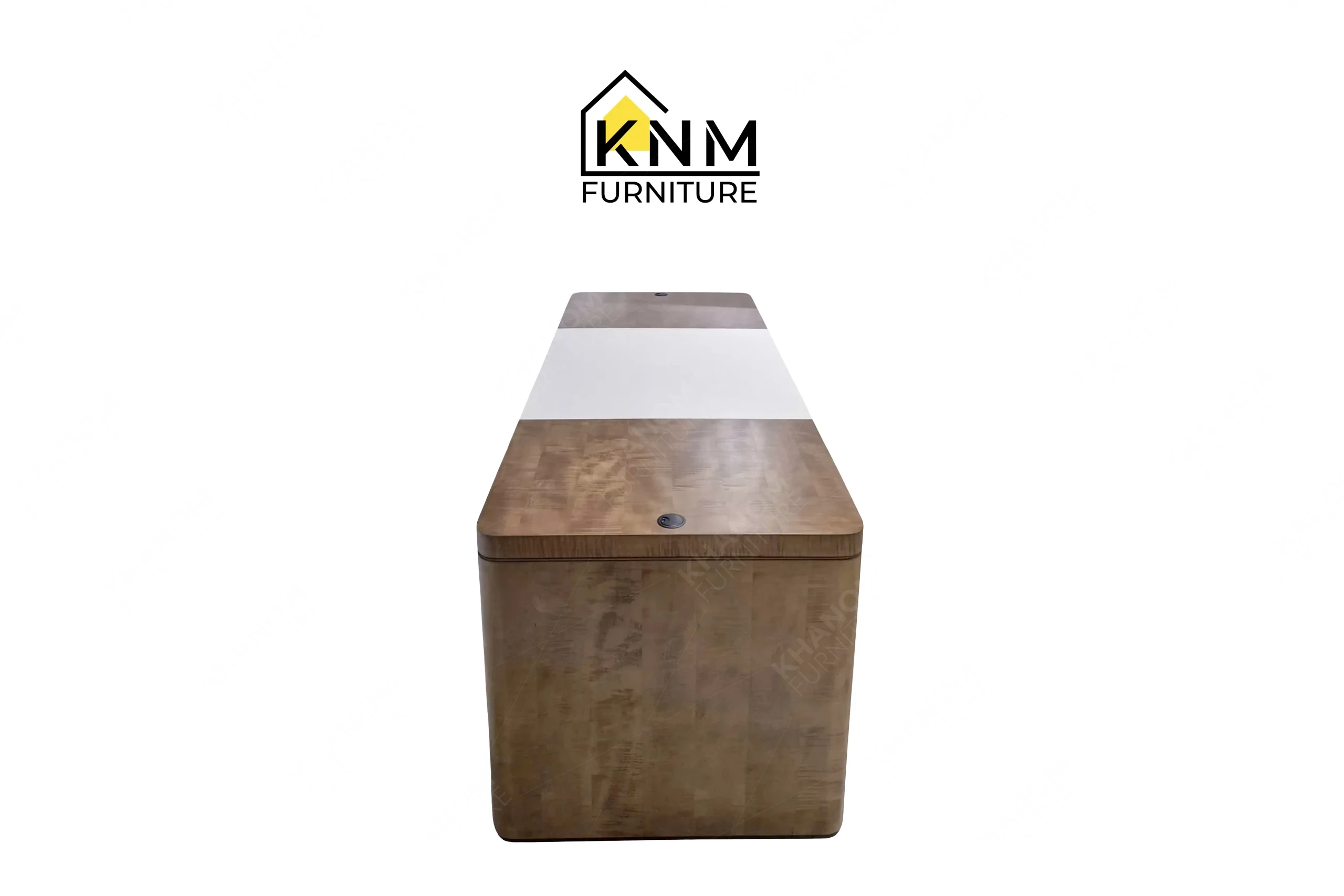 The side profile of the figured walnut lobby concierge desk highlights the structural depth and radius corners specified by Khanom Furniture.
