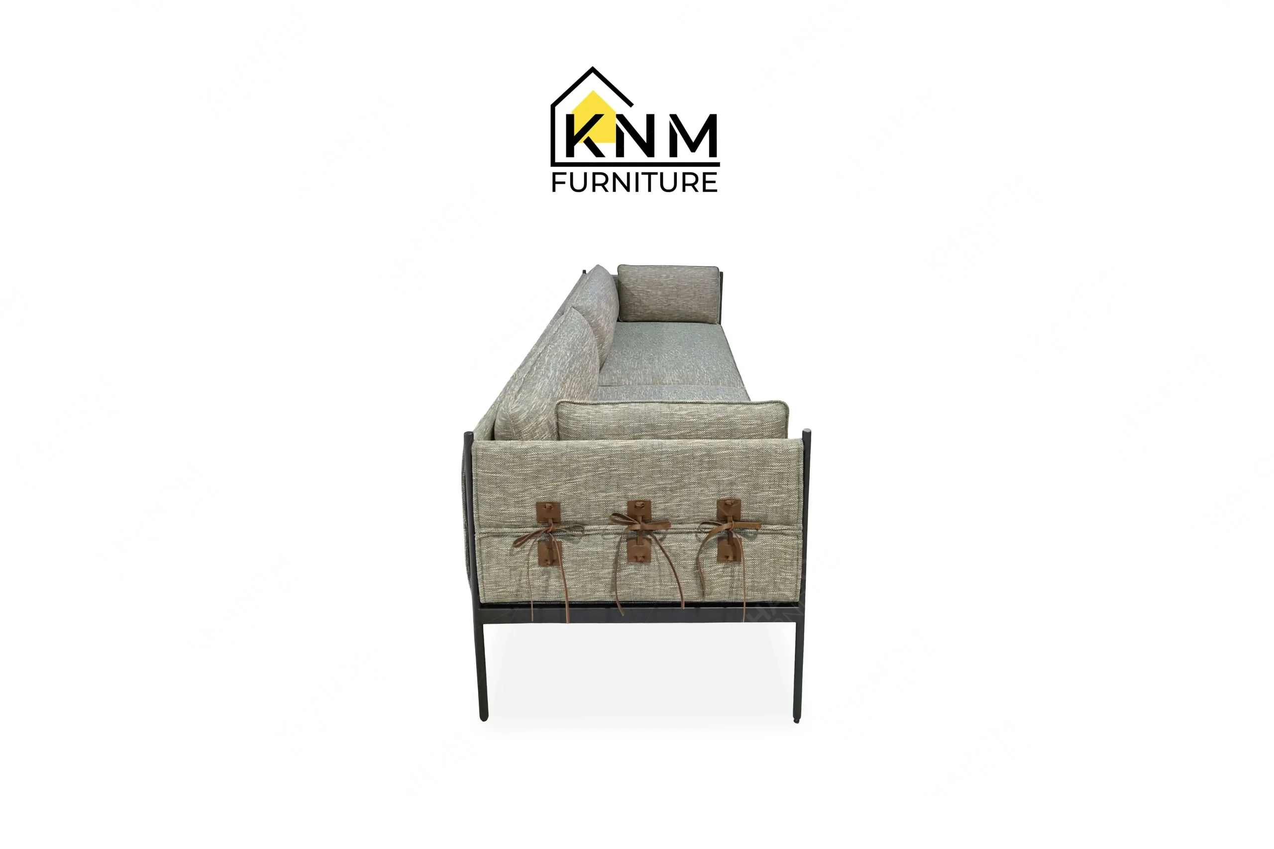 The side profile of the powder-coated steel lounge sofa highlights the Caroll Leather tabs and steel framework specified by Khanom Furniture.