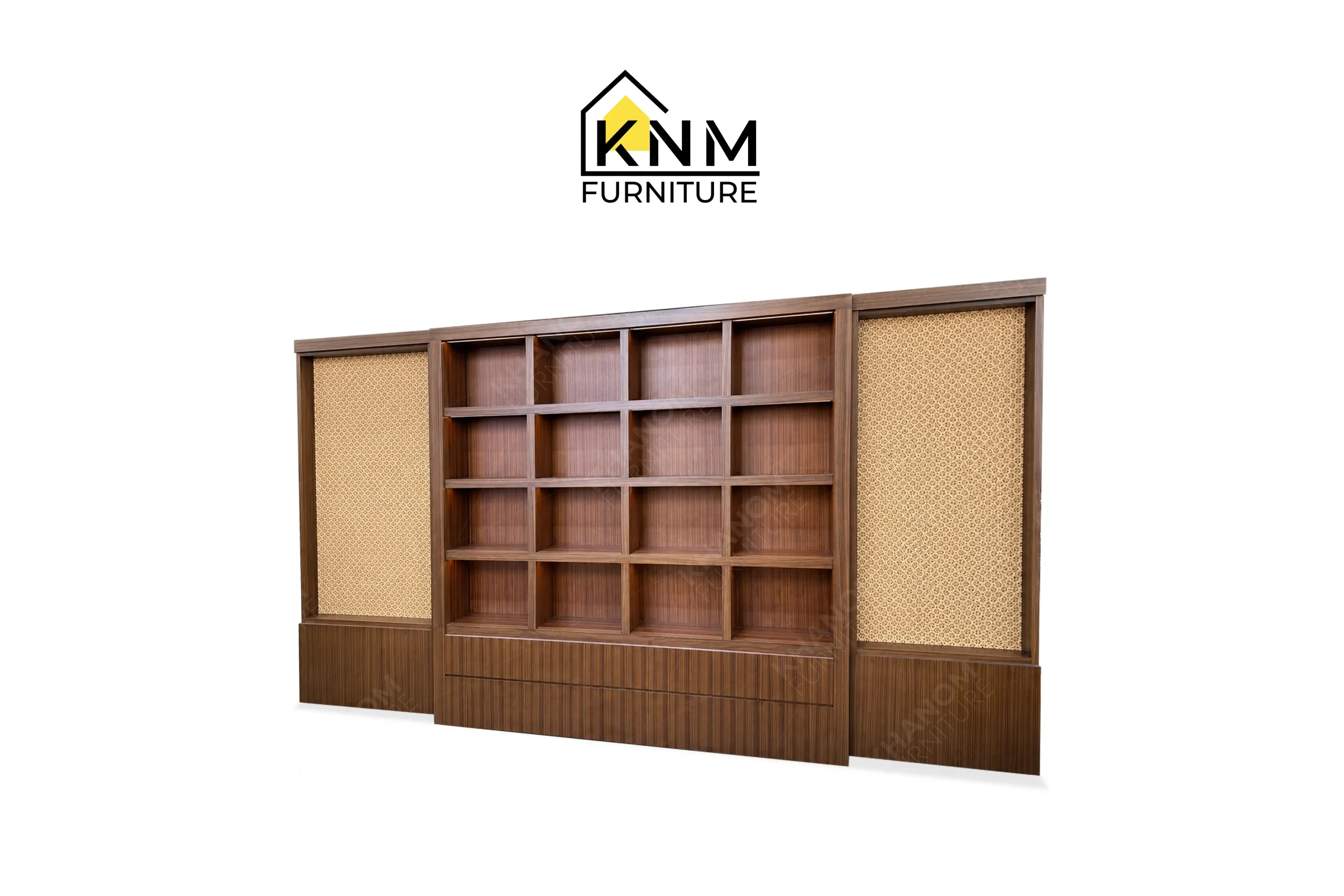 A perspective view illustrating the modular scale and geometric shelving of the teak veneer rattan display cabinet produced by Khanom Furniture.