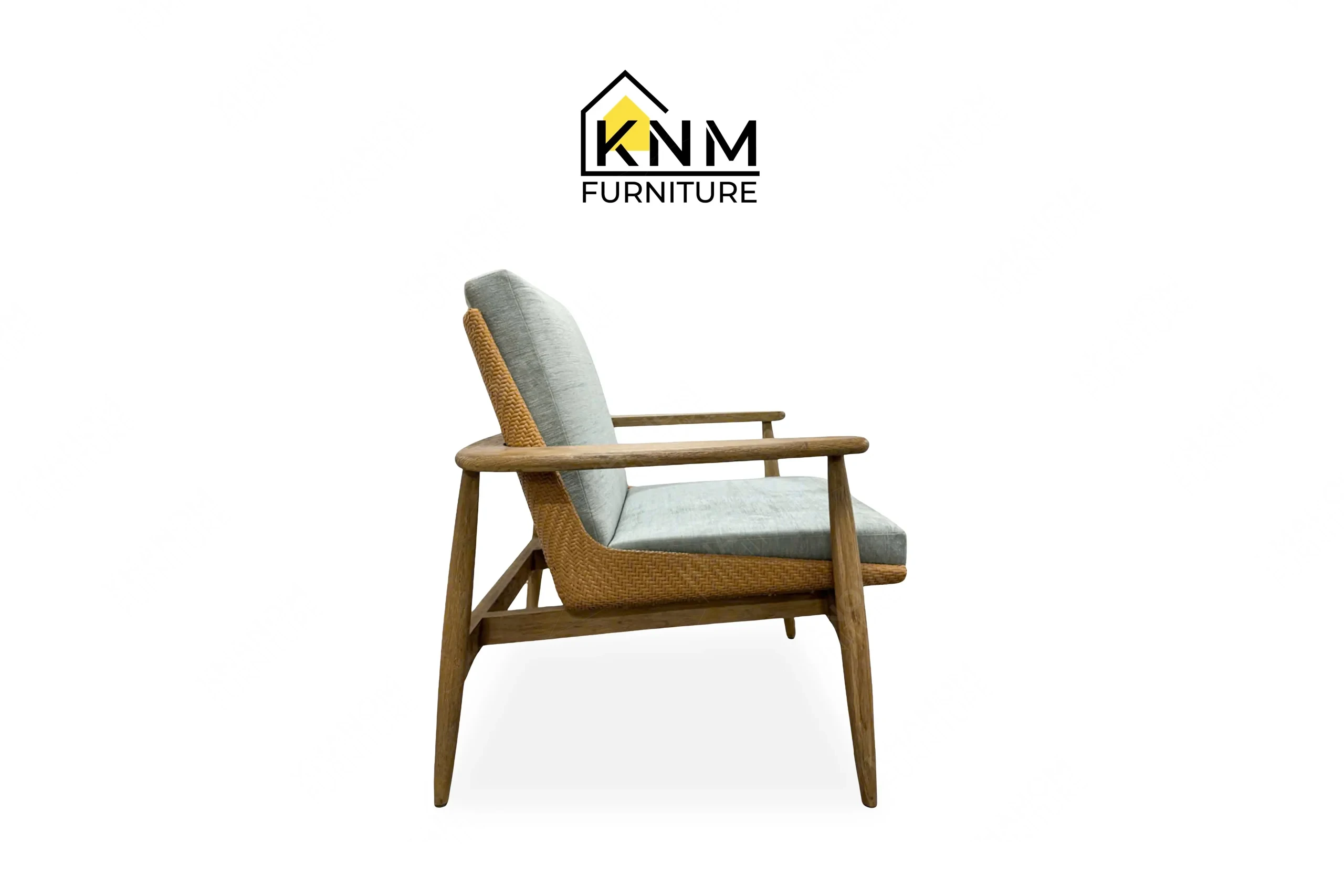 The side profile of the white oak synthetic caning lounge chair highlights the structural framing and caning detail specified by Khanom Furniture.