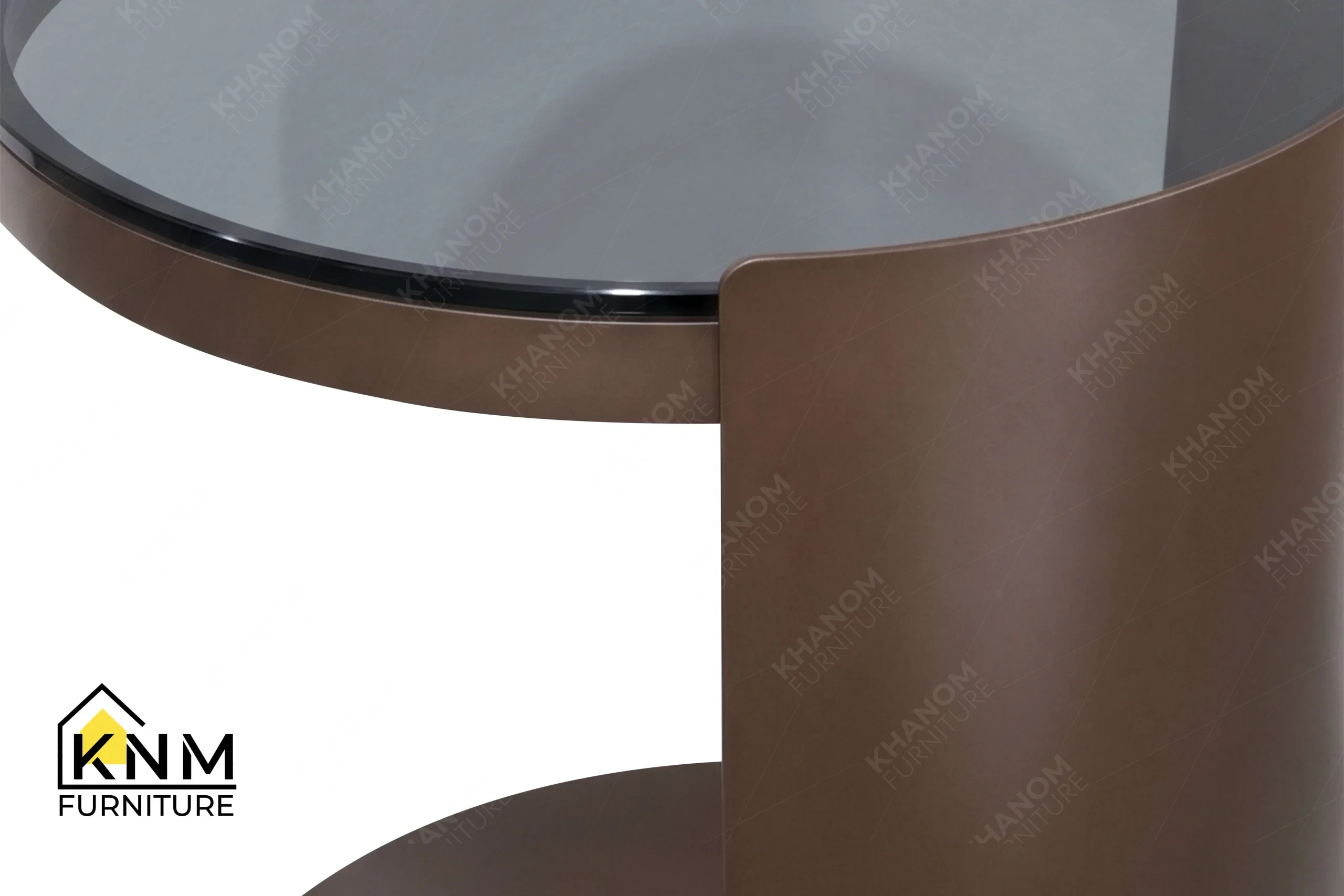 A detailed material zoom of the bronze Granex glass C-table by Khanom Furniture, showing the frosted bronze glass adjacent to the plated metal.