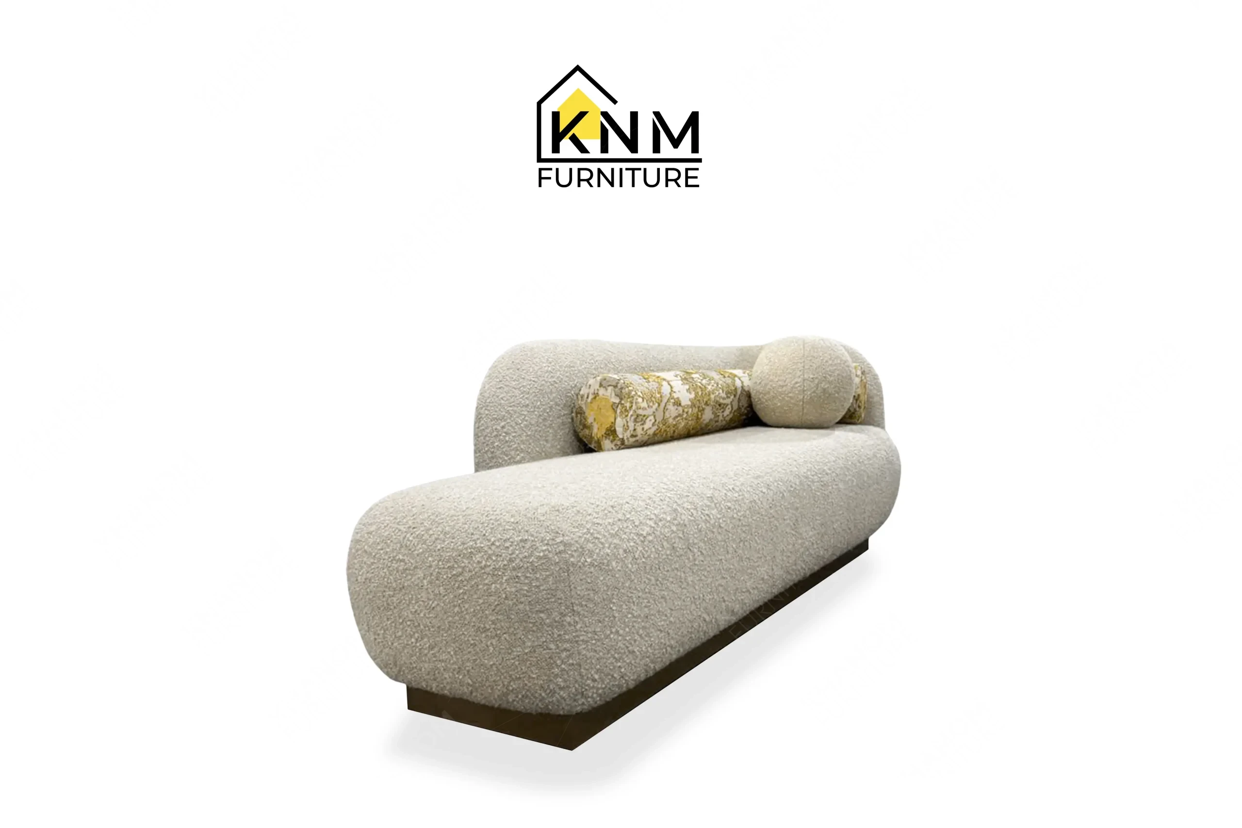 This rear view captures the continuous tight back upholstery of the Opuzen fabric asymmetrical bedroom sofa engineered by Khanom Furniture.