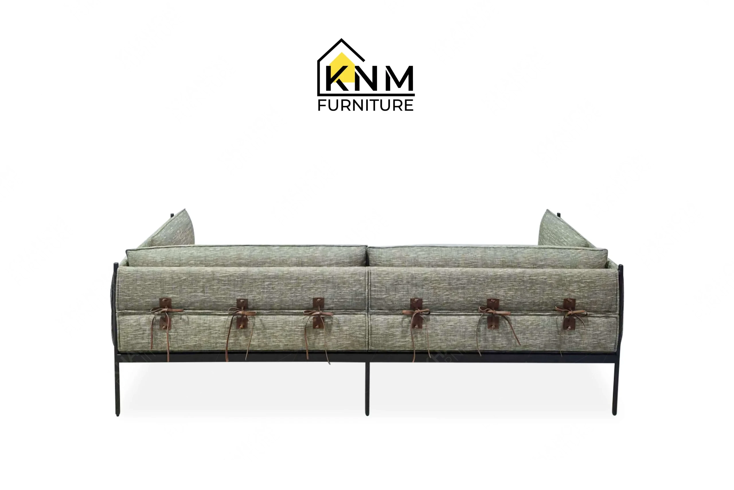 This rear view captures the continuous metal frame and back cushions of the powder-coated steel lounge sofa engineered by Khanom Furniture.