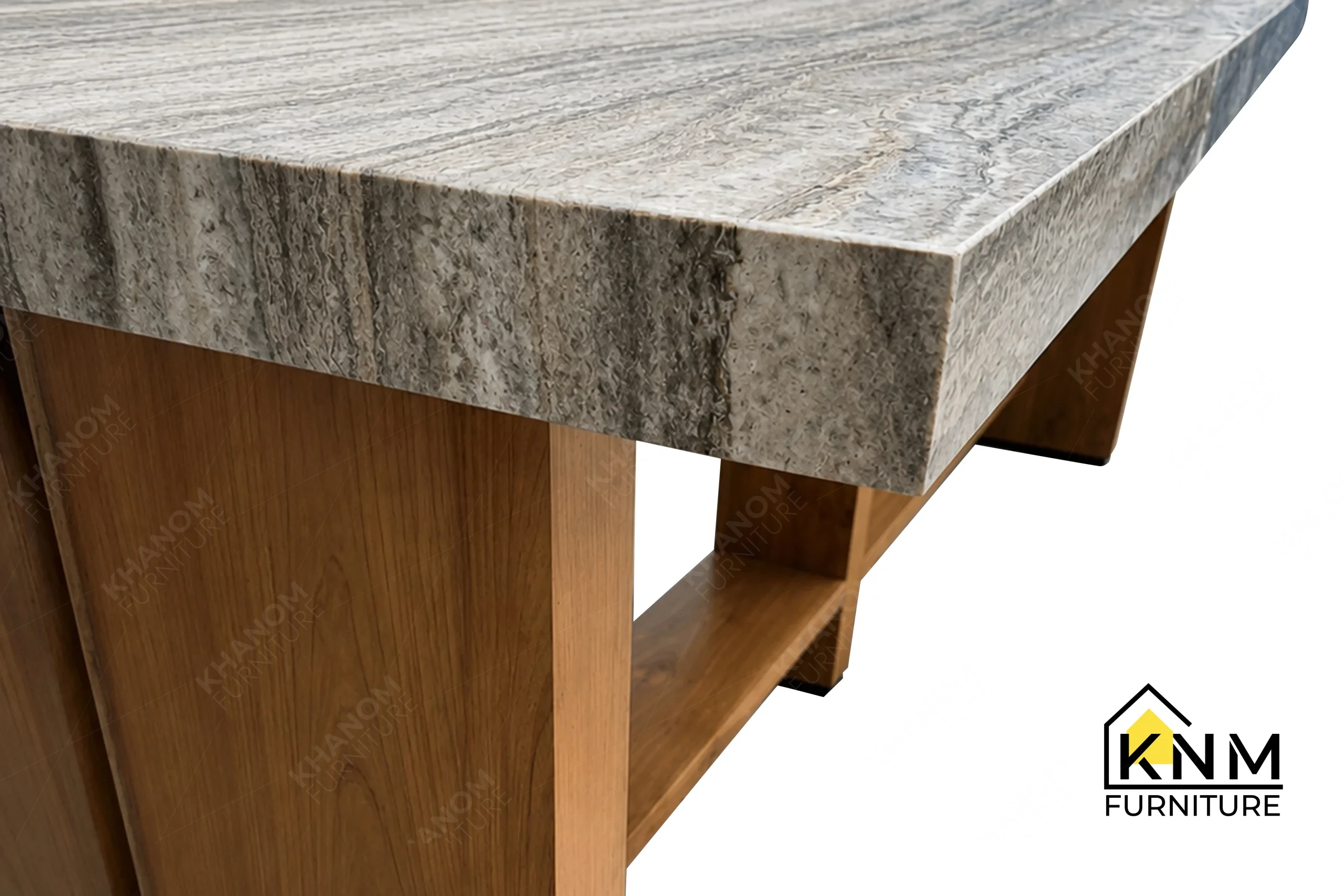 A detailed material zoom of the stone top solid wood communal table by Khanom Furniture, showing the natural stone veining adjacent to the wood base.