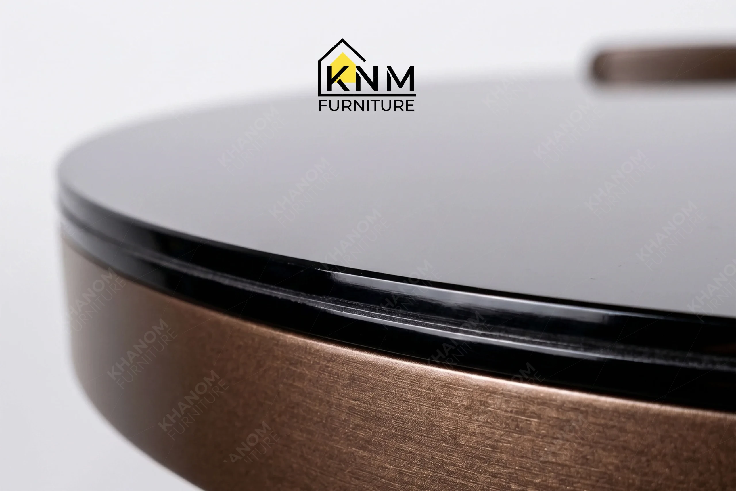 A technical detail of the bronze Granex glass C-table from Khanom Furniture, describing the pencil edge profile on the inset glass.