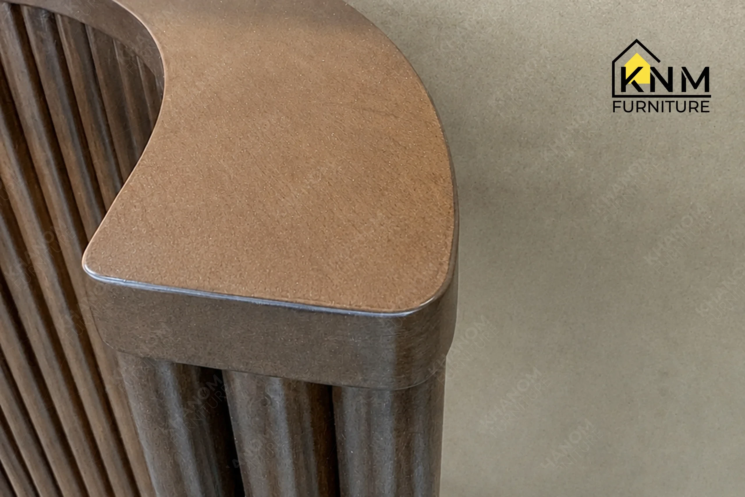 A detailed material zoom of the hardwood tambour double queen bed by Khanom Furniture, showing the milled hardwood texture and rich stain finish.