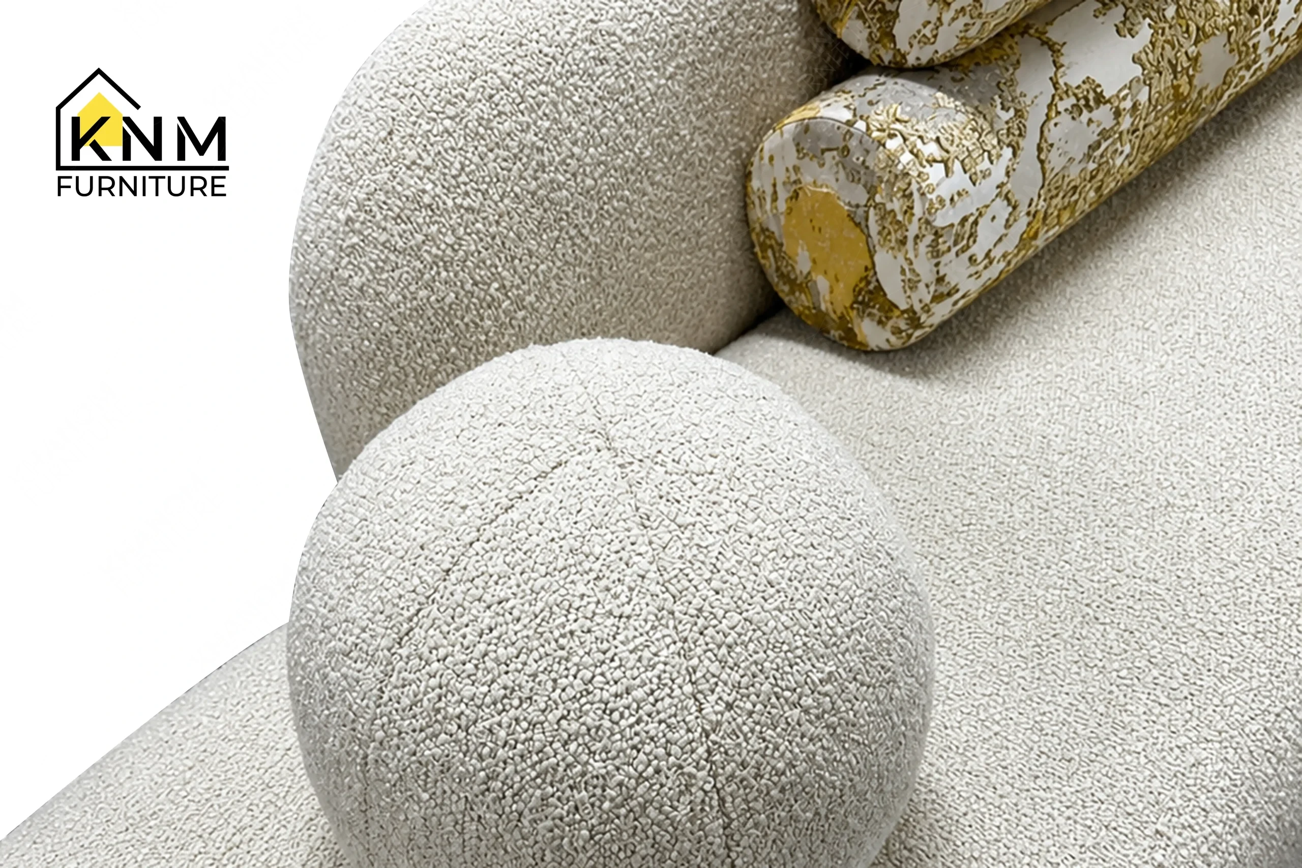 A detailed material zoom of the Opuzen fabric asymmetrical bedroom sofa by Khanom Furniture, showing the textured Opuzen fabric weave.