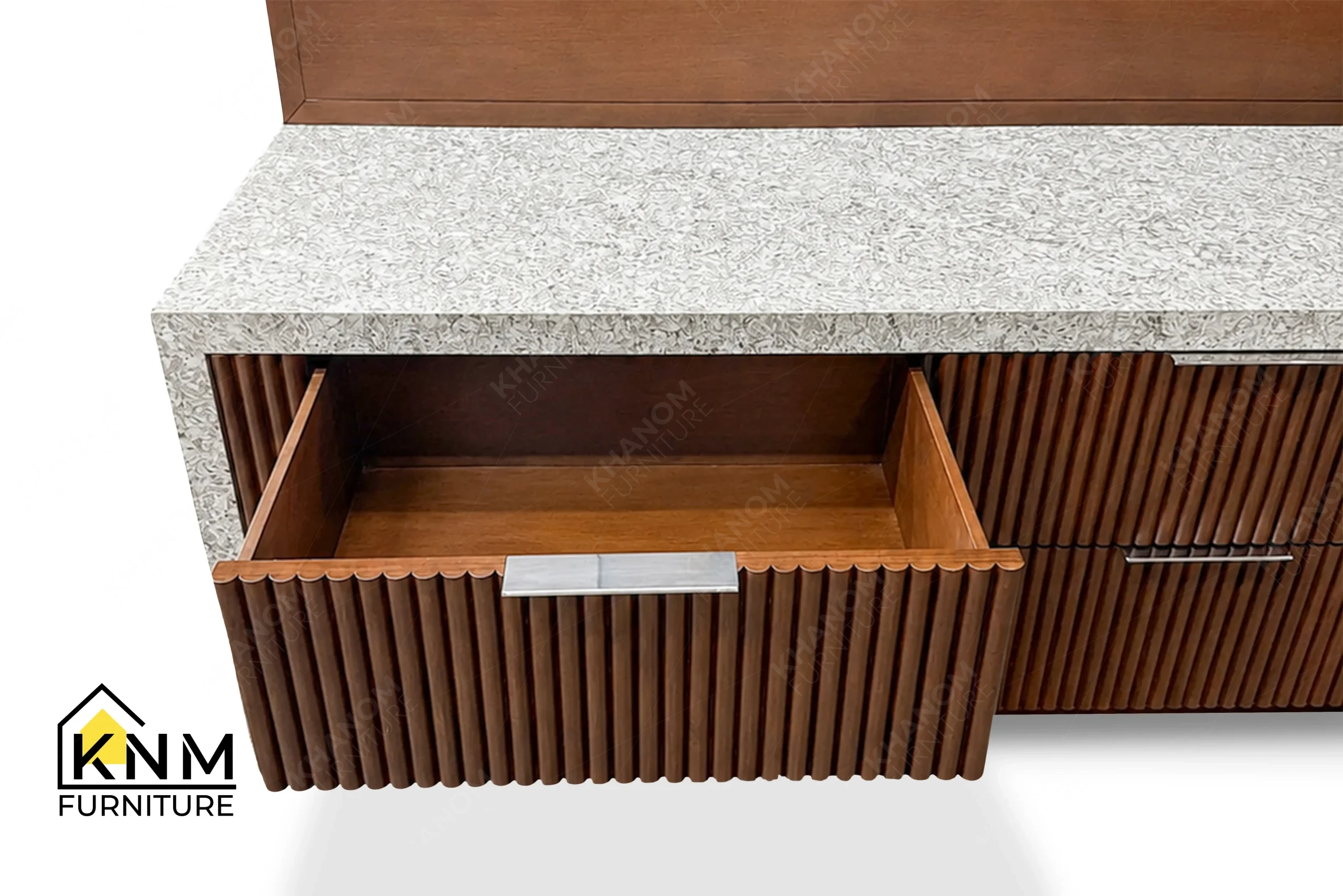 A detailed material zoom of the quartz top tambour media dresser by Khanom Furniture, showing the milled beech wood adjacent to the quartz top.