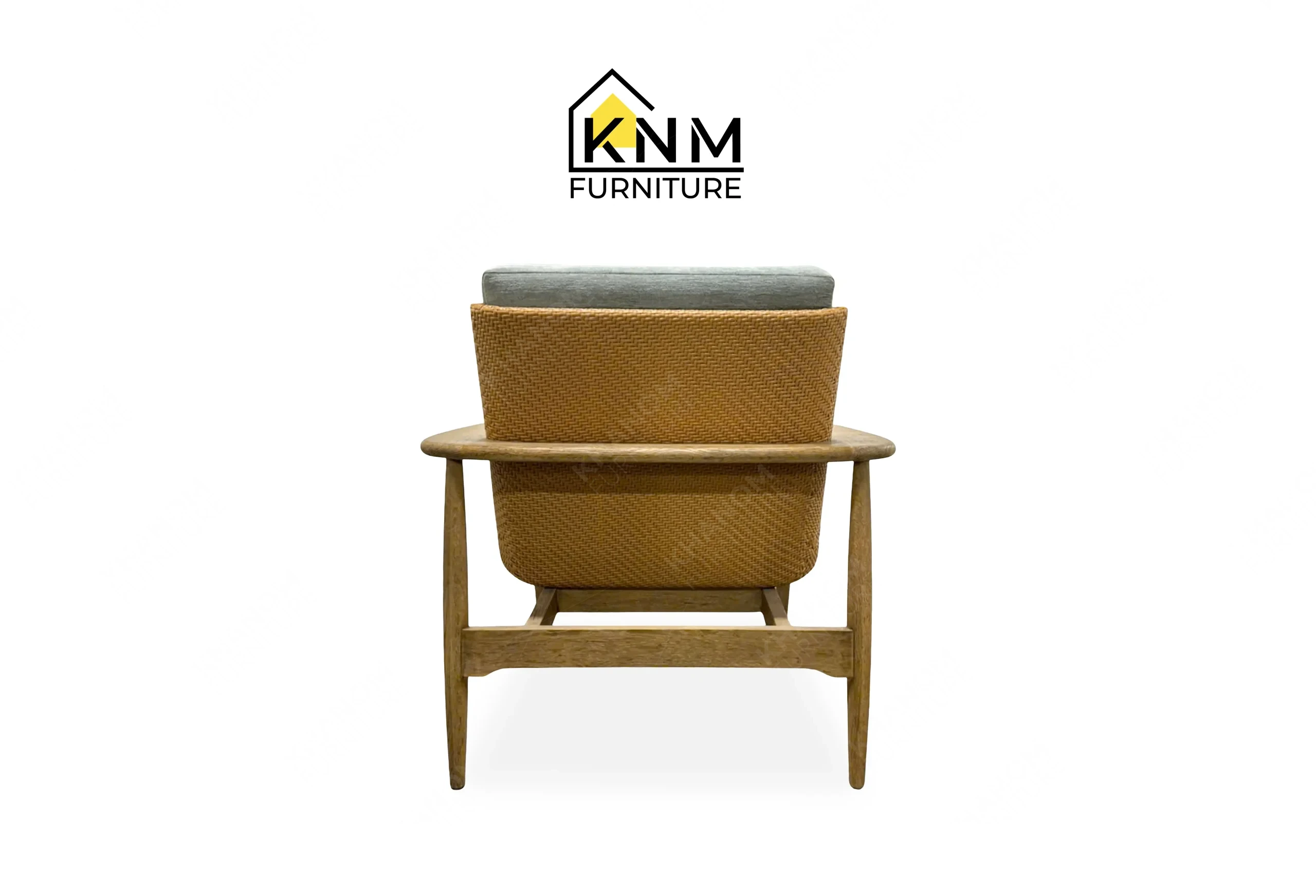 A detailed material zoom of the white oak synthetic caning lounge chair by Khanom Furniture, showing the open grain finish adjacent to the fabric and caning.