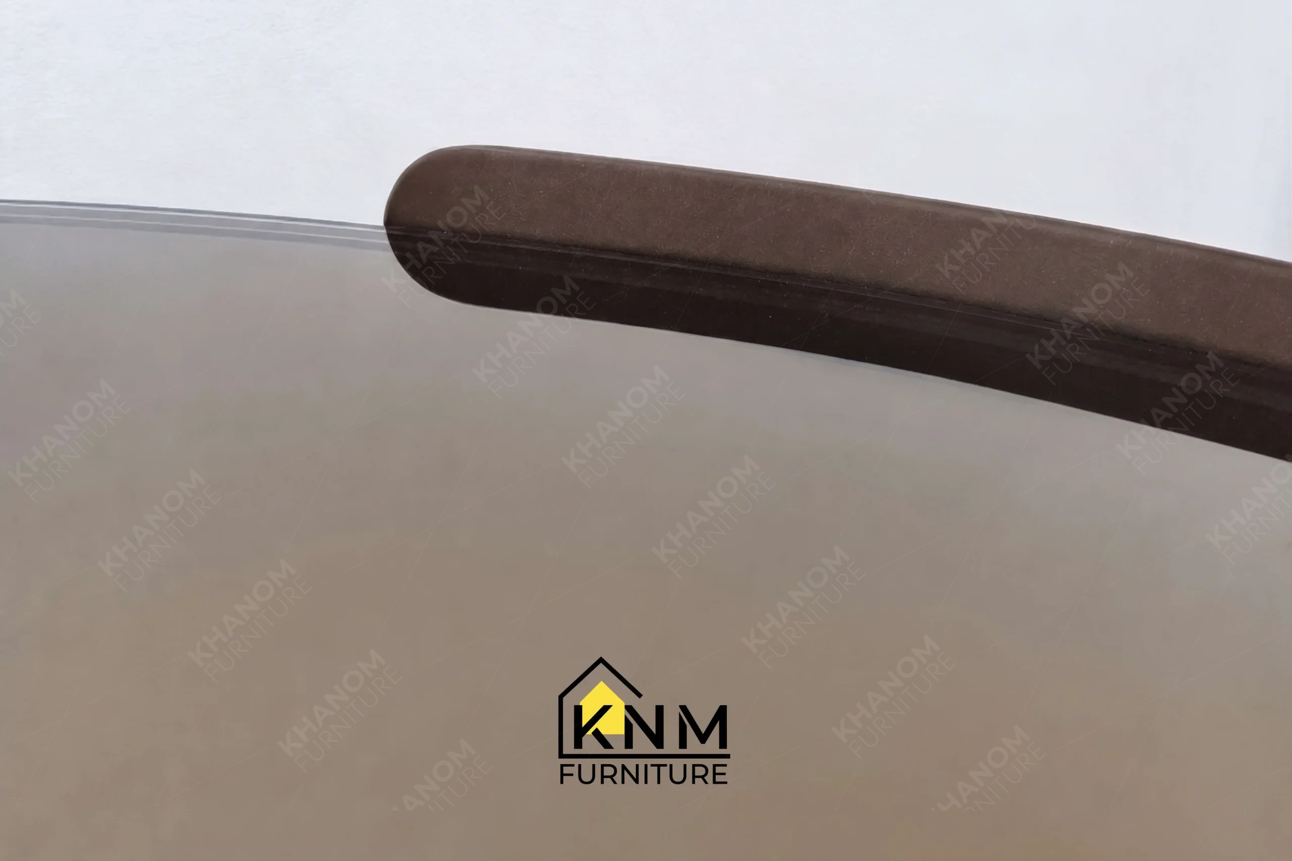 The surface texture detail of the bronze Granex glass C-table manufactured by Khanom Furniture reveals the protective plated finish on the metal frame.