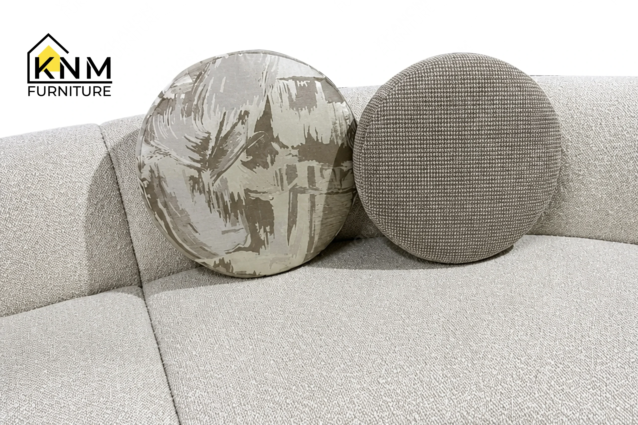 A technical detail of the curved Opuzen fabric sectional sofa from Khanom Furniture, describing the custom 18-inch and 20-inch accent pillows.