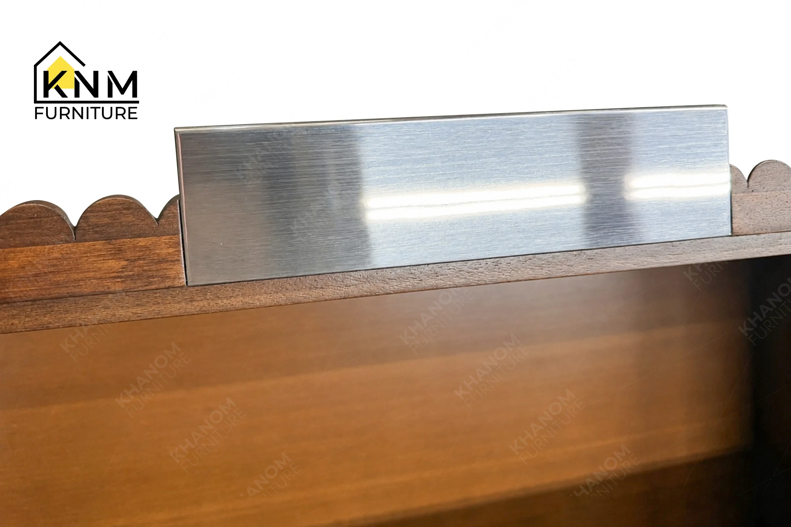 A technical detail of the quartz top tambour media dresser from Khanom Furniture, describing the polished chrome pulls mounted on the tambour wood.