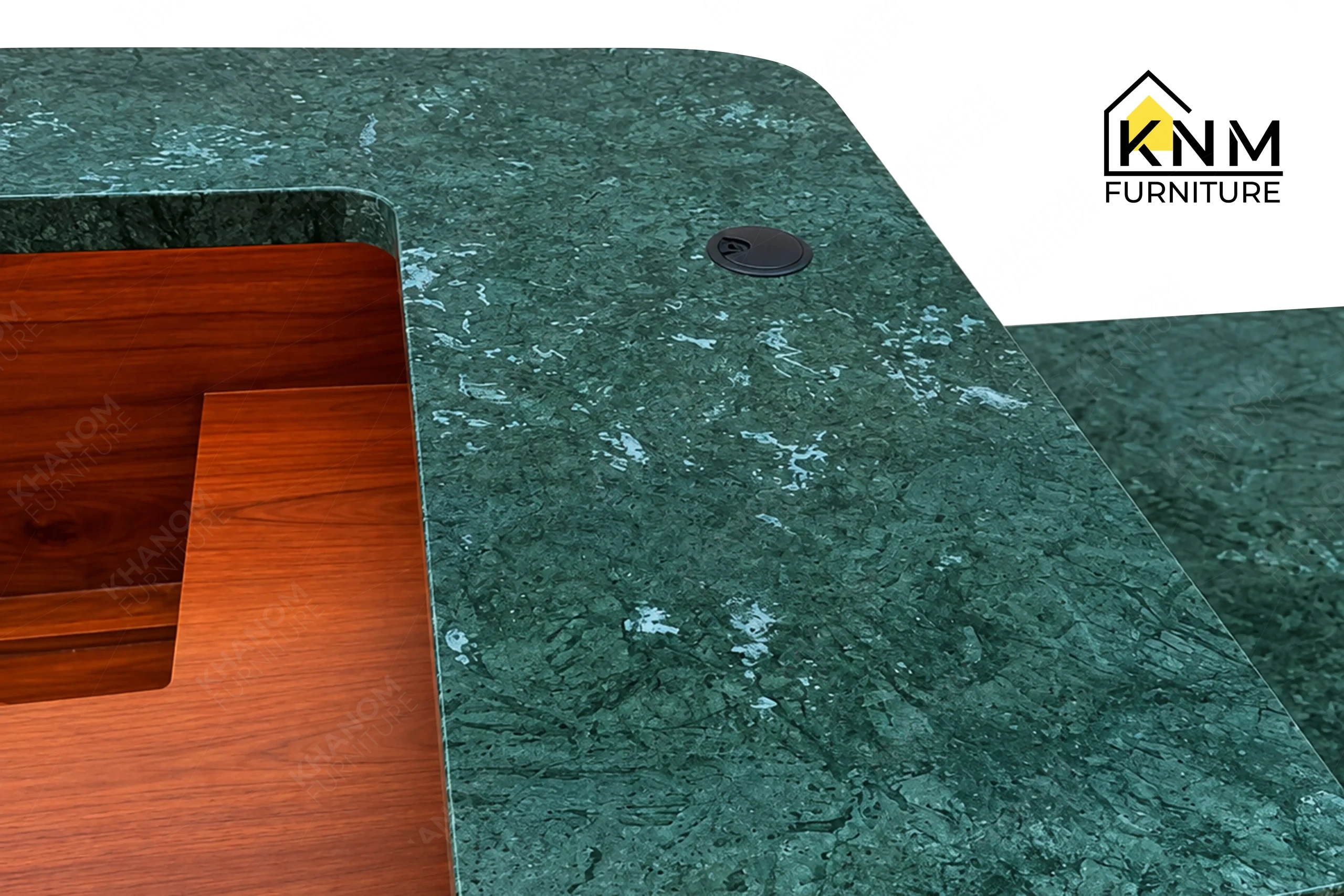 The surface texture detail of the stone top solid wood reception desk manufactured by Khanom Furniture reveals the integrated LED task lighting and power modules.