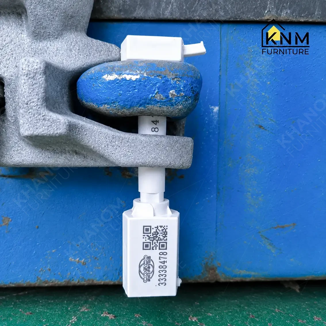 White bolt seal with QR code applied to blue container door — carrier seal for US Customs chain of custody, hospitality furniture export from Vietnam