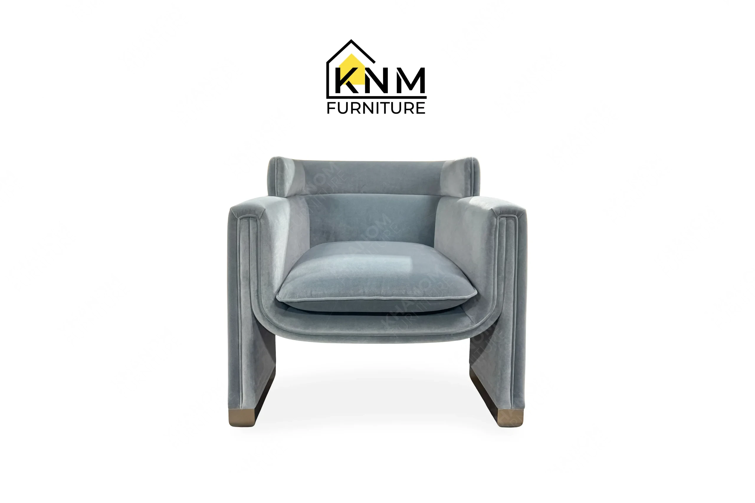 This front view displays the Momentum fabric upholstered lounge chair manufactured by Khanom Furniture, highlighting the blocky armrests and tight seat cushion.