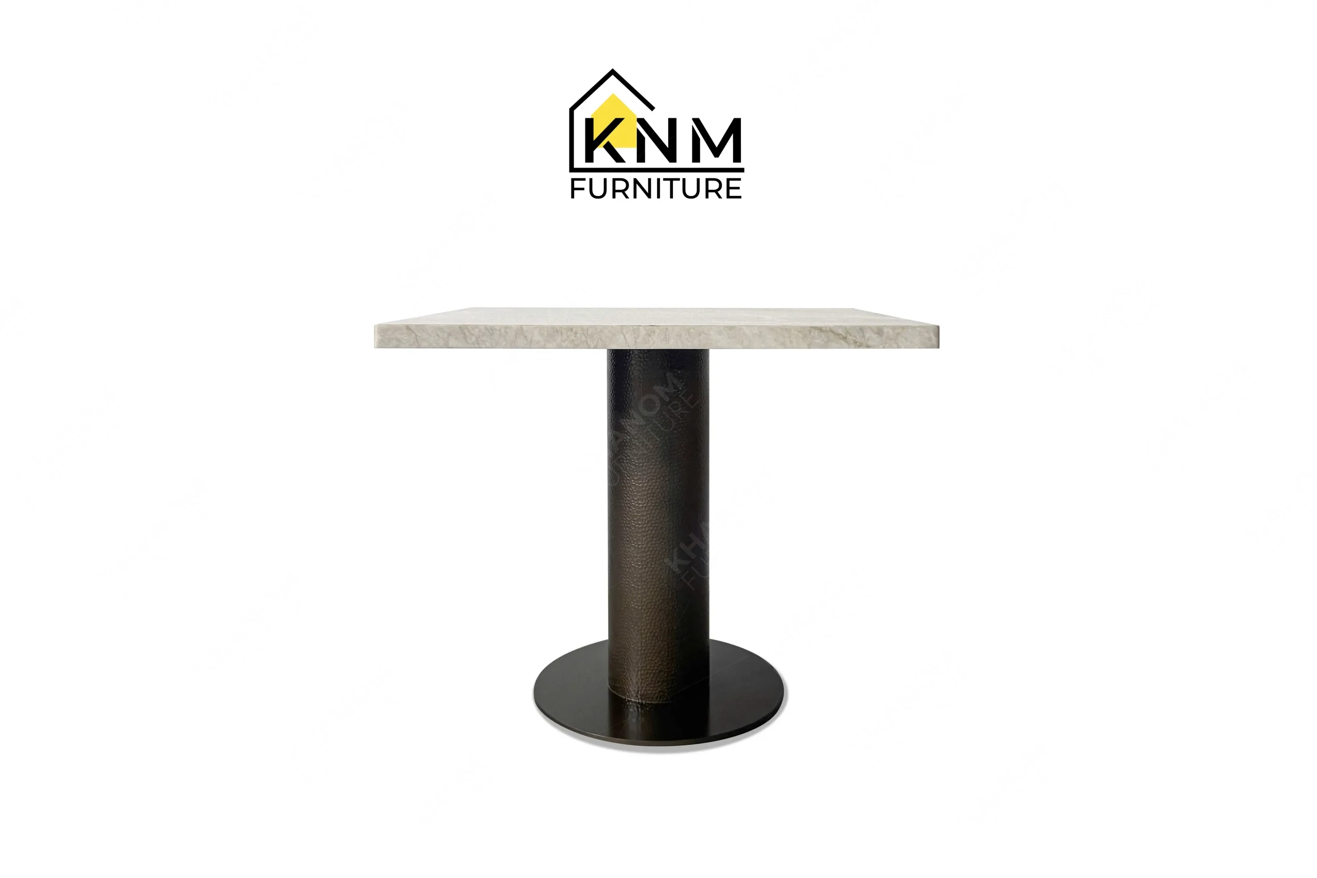 This front view displays the stone top metal pedestal dining table manufactured by Khanom Furniture, highlighting the Hammered Bronze column and square stone surface.