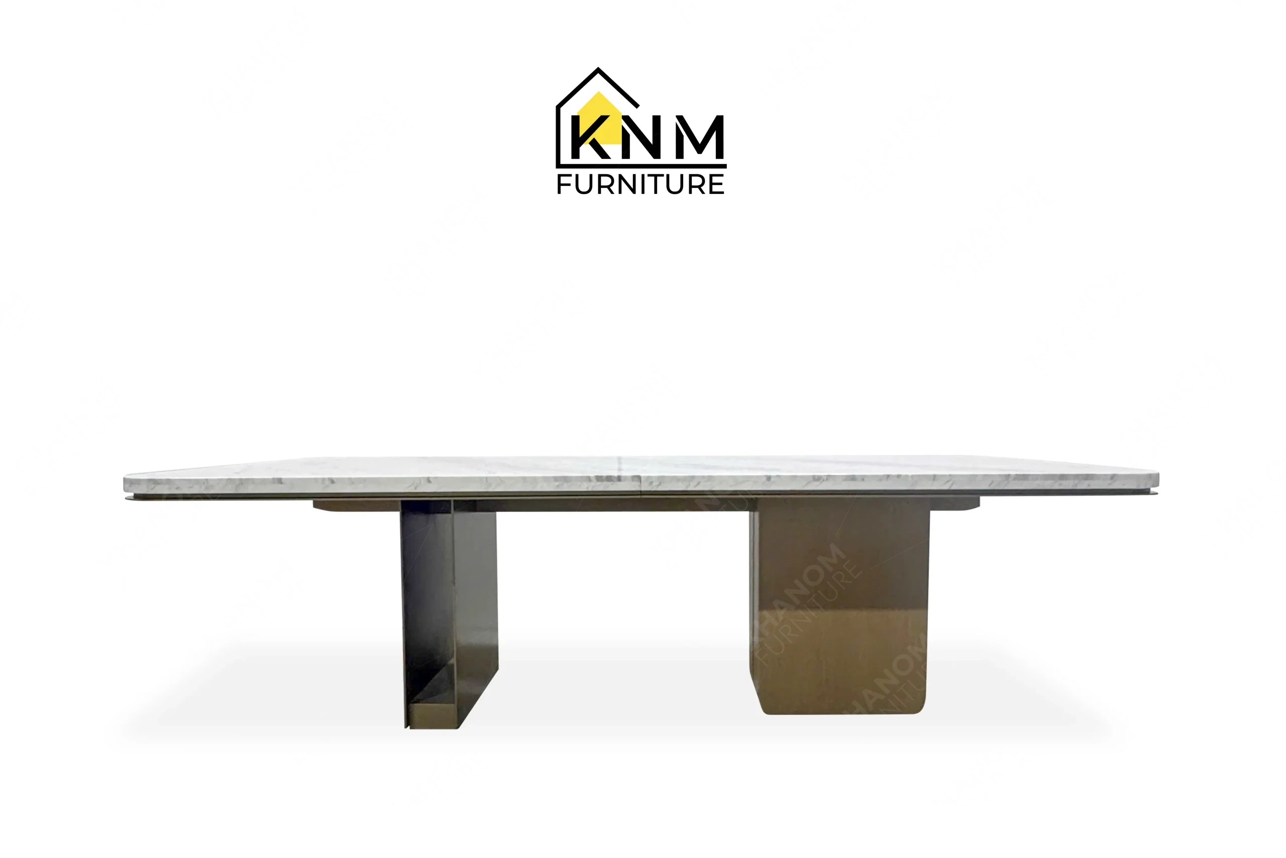 This front view displays the Volakas marble Stoneguard oak dining table manufactured by Khanom Furniture, highlighting the asymmetrical bases and thick stone top.