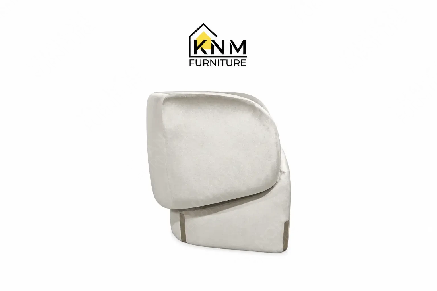 The side profile of the Dedar fabric upholstered lounge chair highlights the ergonomic pitch and tight upholstery specified by Khanom Furniture.