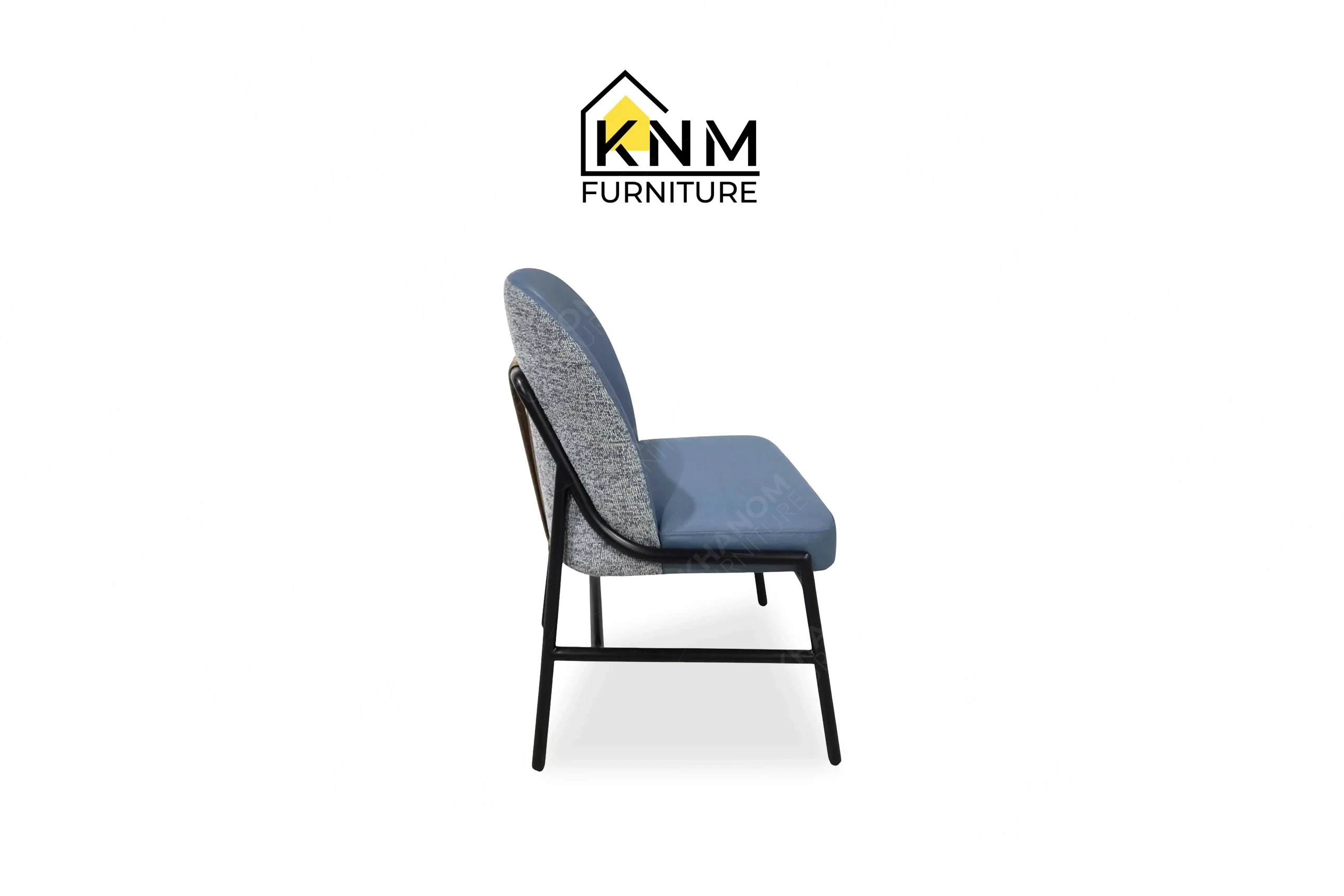 The side profile of the double walled aluminum upholstered dining chair highlights the structural stretcher and frame pitch specified by Khanom Furniture.
