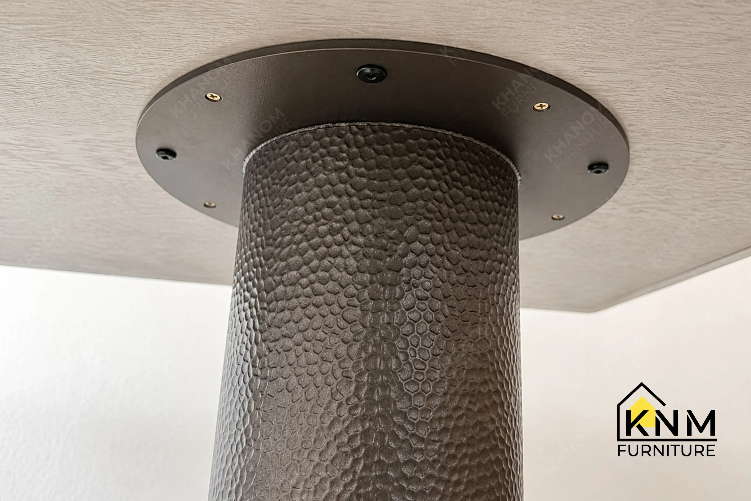 A detailed material zoom of the double pedestal stone dining table by Khanom Furniture, showing the gloss Tuffskin finish on the local Taj Mahal stone.