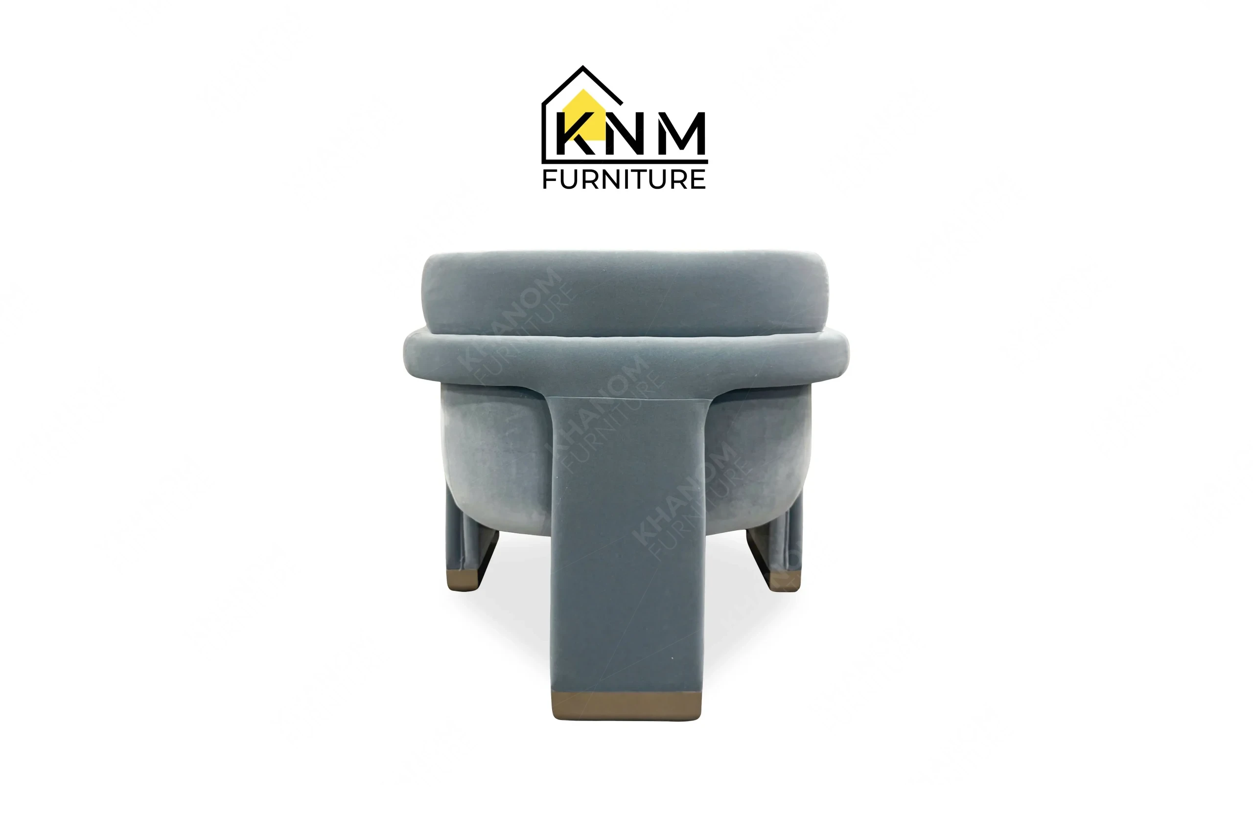 This rear view captures the continuous tight back upholstery of the Momentum fabric upholstered lounge chair engineered by Khanom Furniture.