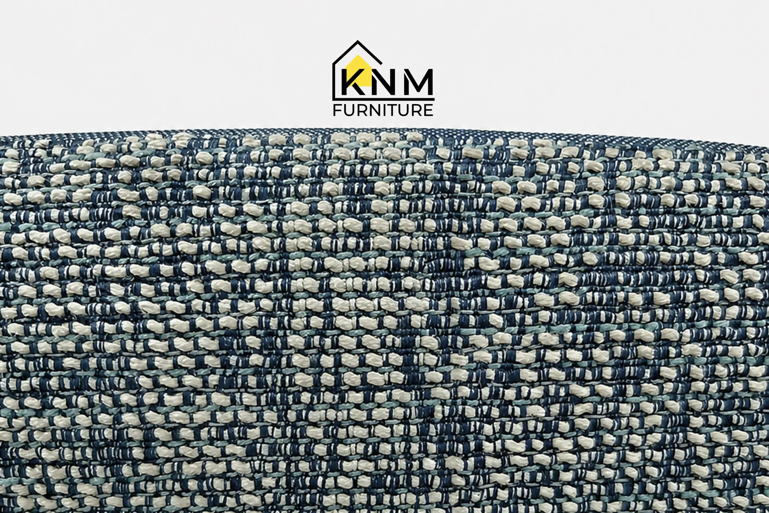 A detailed material zoom of the double walled aluminum upholstered dining chair by Khanom Furniture, showing the Concertex fabric weave.