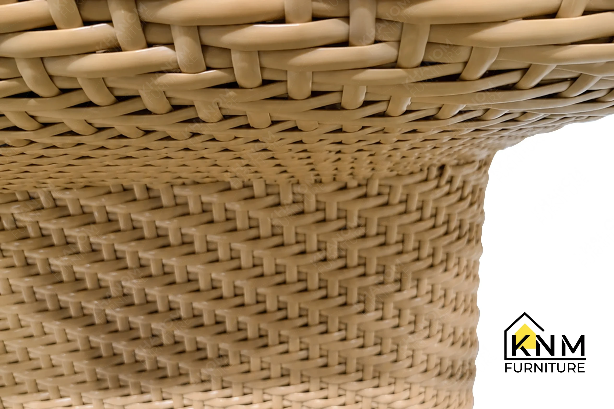 A detailed material zoom of the herringbone synthetic caning lounge chair by Khanom Furniture, showing the woven synthetic material adjacent to the fabric.