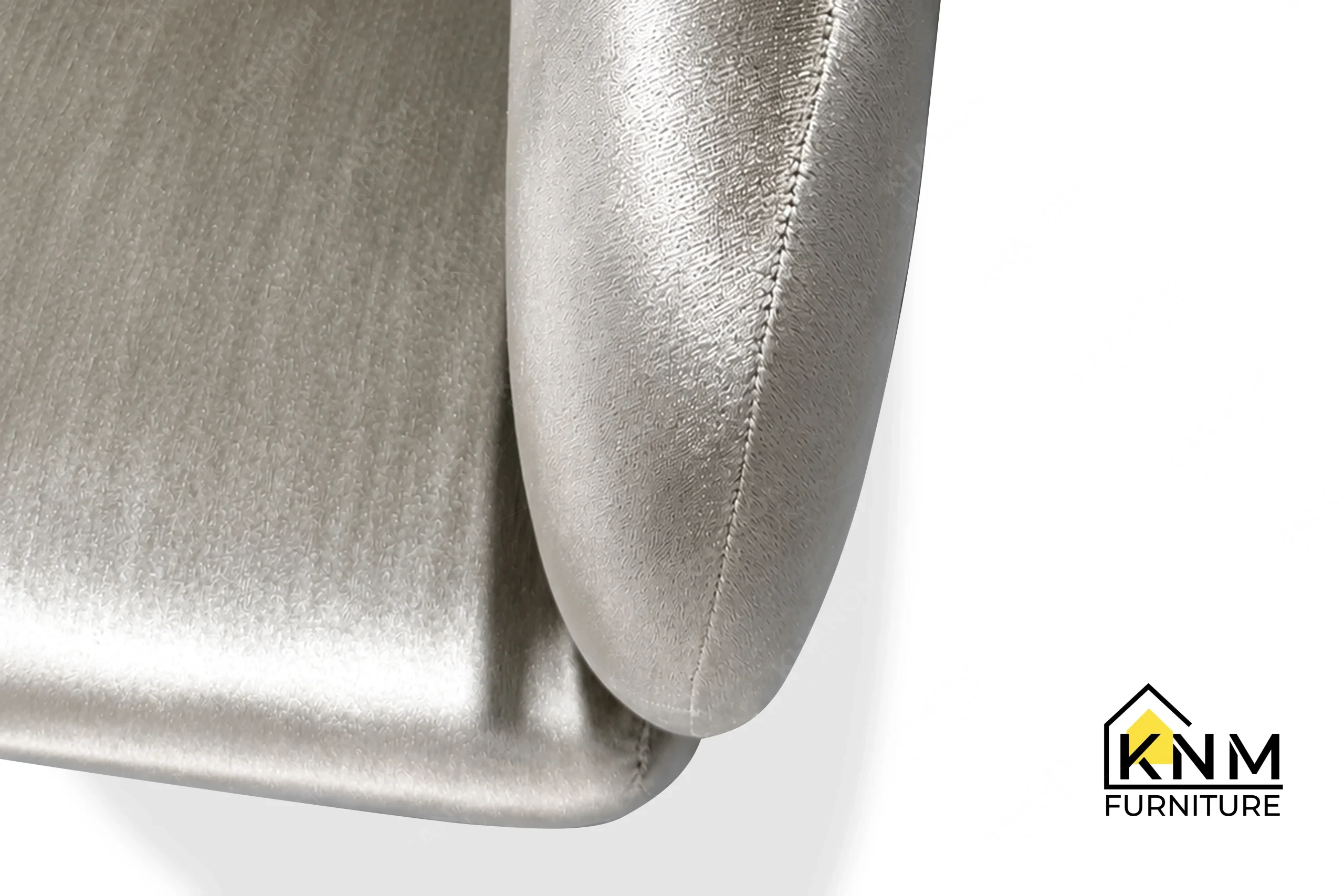 The surface texture detail of the Dedar fabric upholstered lounge chair manufactured by Khanom Furniture reveals the protective Teflon tap-in glides.