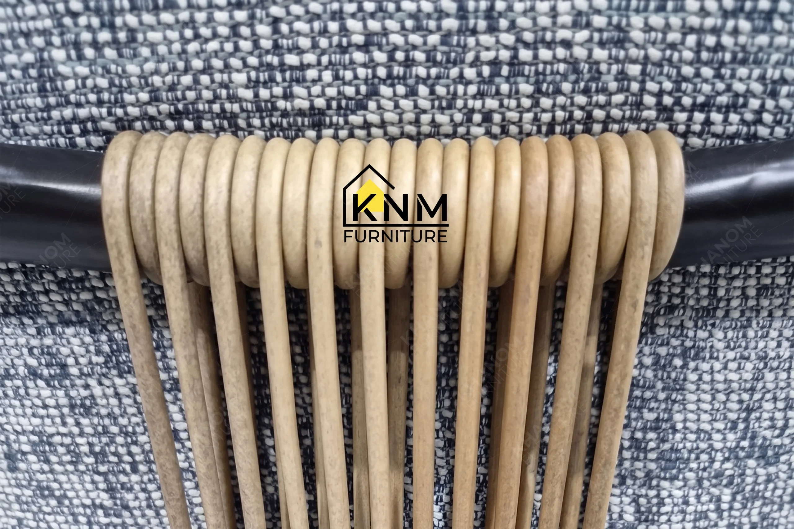 A technical detail of the double walled aluminum upholstered dining chair from Khanom Furniture, describing the powder-coated aluminum joinery.